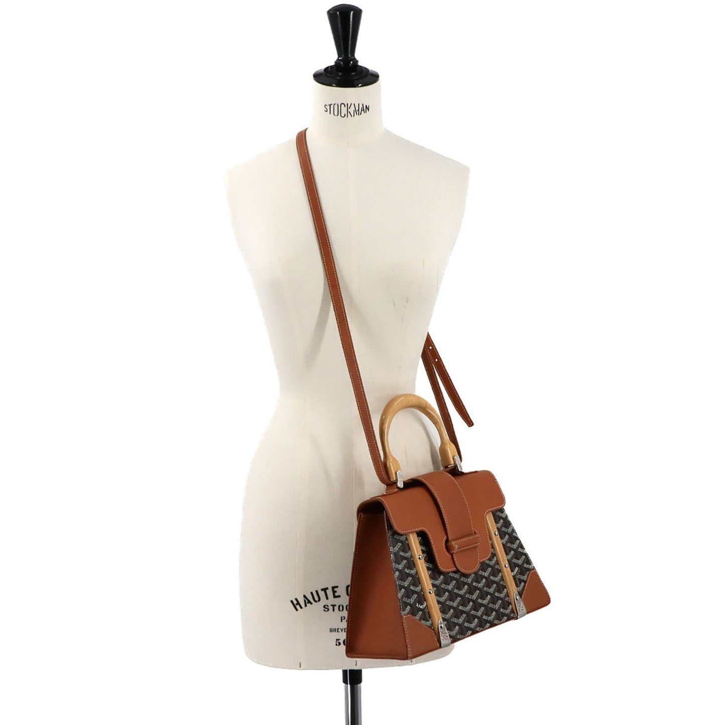 Goyard Saigon PM 2-way hand/shoulder bag in PVC, leather, wood, black, brown, and herringbone.