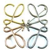 LOEWE Anagram Brooch in 4 Colors: Gold, Silver, Bronze. Comes with dust bag. Highly popular and recommended for women — Like New
