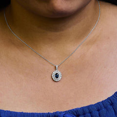 14K White Gold Oval Blue Sapphire and 3/4 Cttw Diamond Halo Pendant Necklace