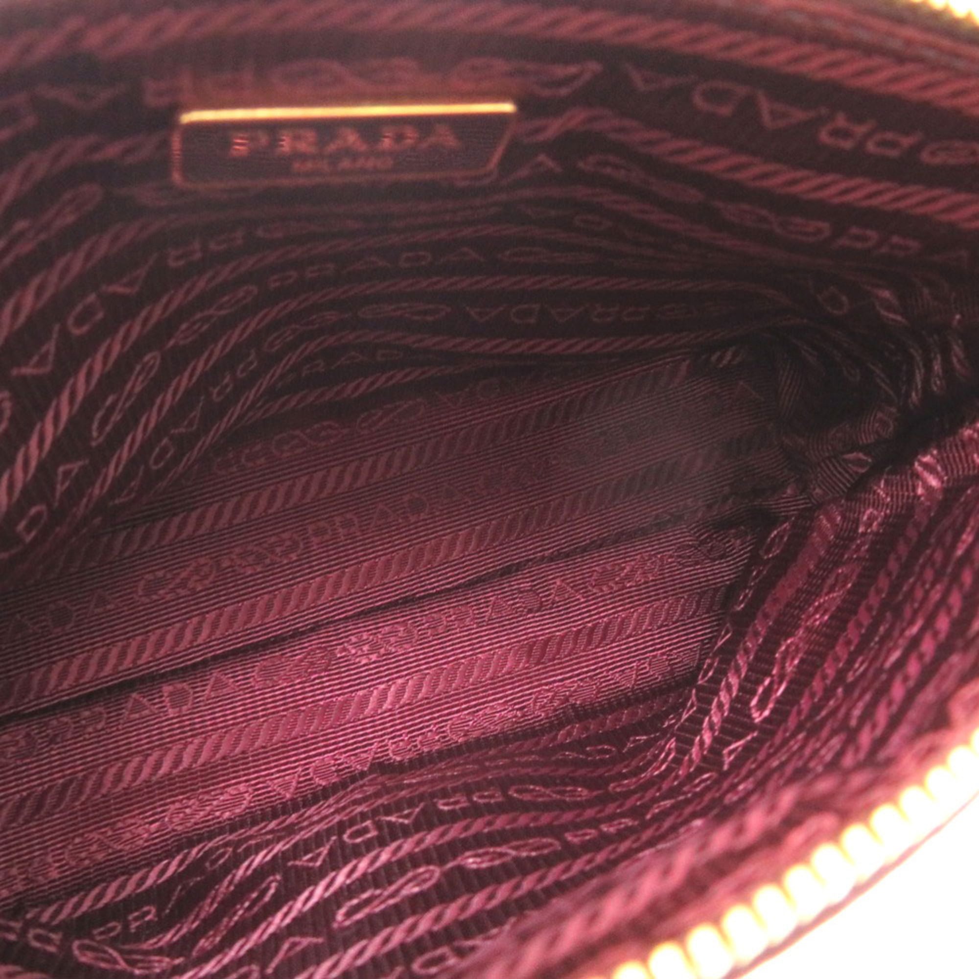Excellent condition Prada leather burgundy pouch bag with gold hardware, 1302