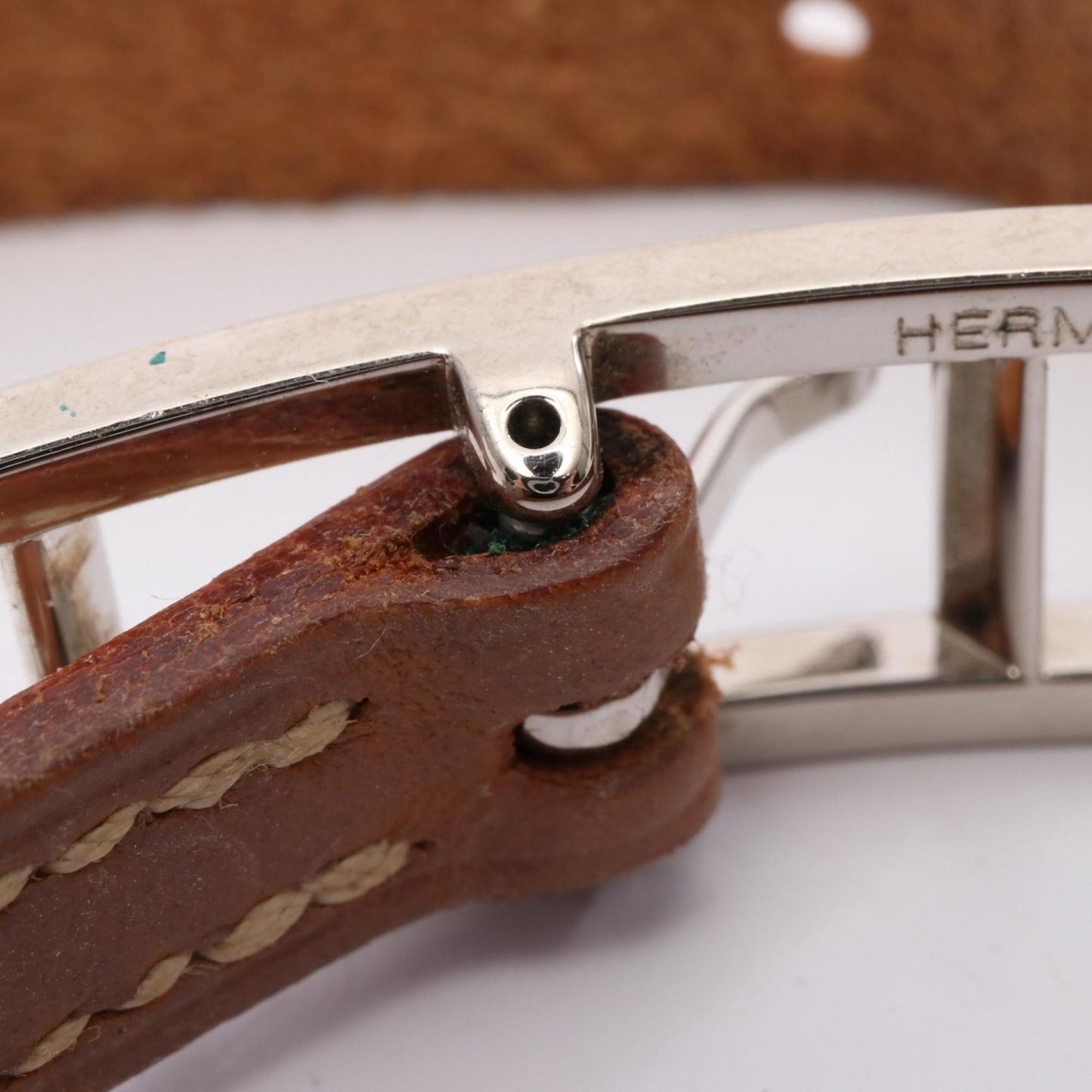 Hermes Hermès API 1 bracelet, stainless steel and leather, available in silver brown.