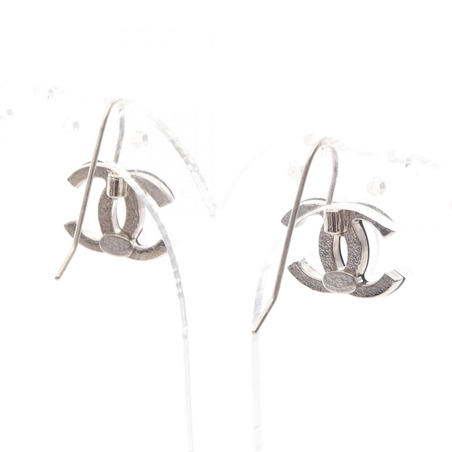 Chanel Coco Mark earrings, stainless steel and plastic, available in clear silver.