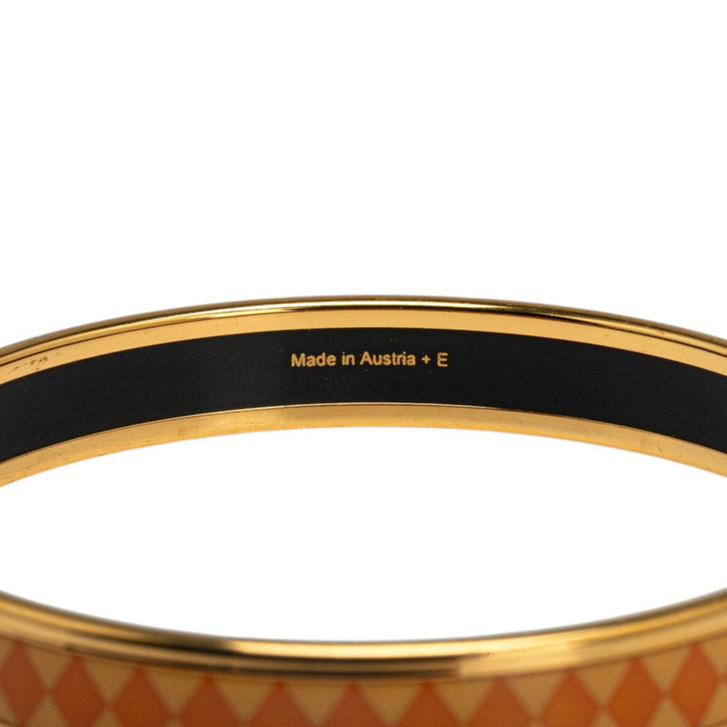 Hermes enamel PM diamond motif bangle in orange and gold plated for women.