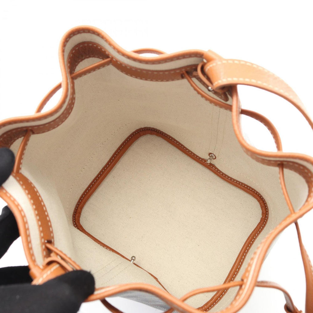 Goyard Petit Flo shoulder bag in coated canvas and leather. Available black, brown, multicolor.