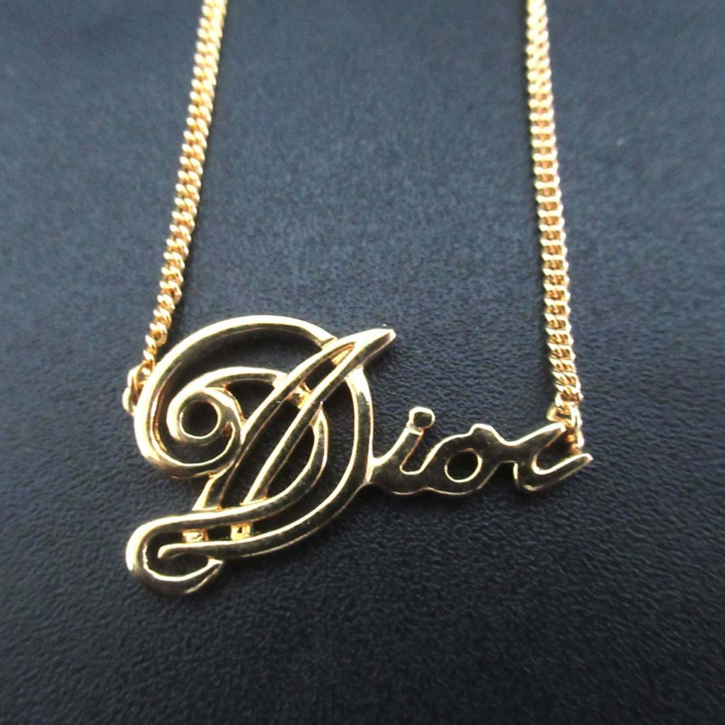 Vintage Christian Dior logo chain necklace pendant in GP gold for women.
