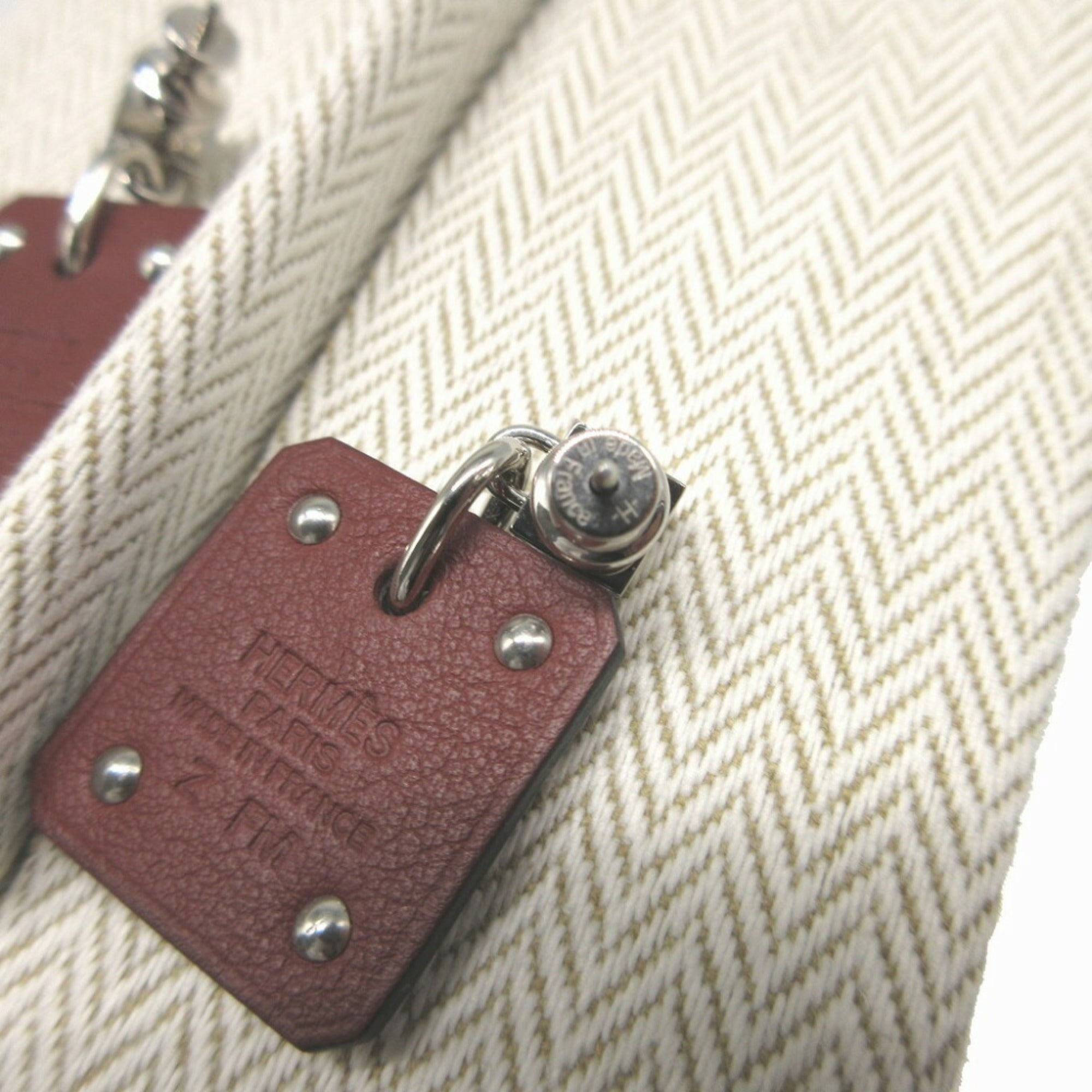 Hermes Asdukur Z engraved heart leather metal brown silver earrings 1256HERMES — Like New