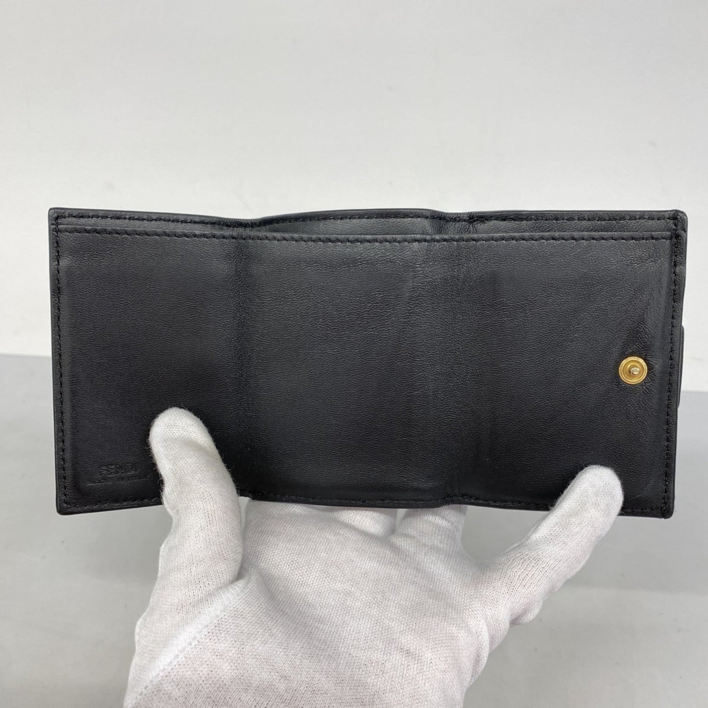 Fendi tri-fold wallet in black leather for women