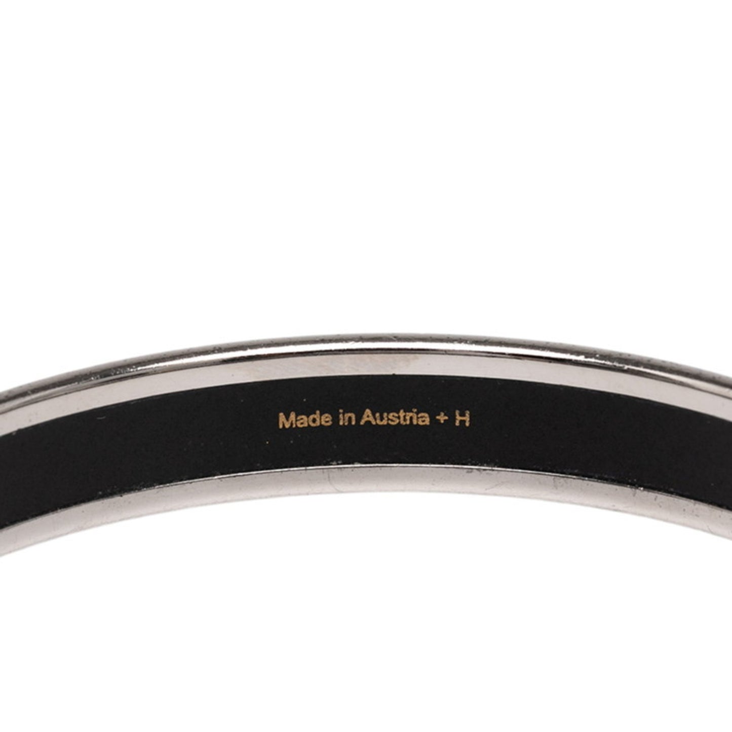 Hermes enamel Chaine d'Ancre motif bangle in silver and orange metal for women.