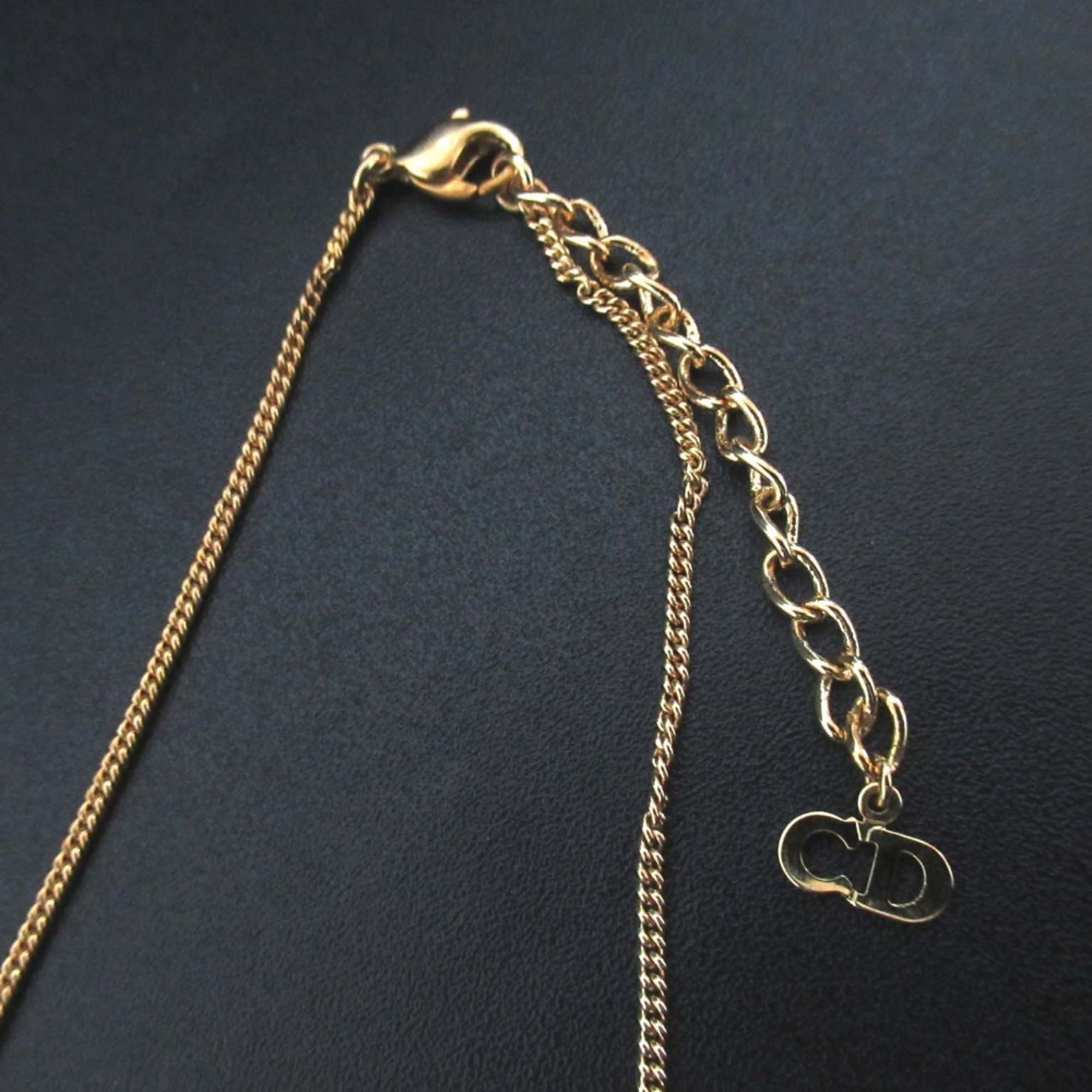 Vintage Christian Dior logo chain necklace pendant in GP gold for women.