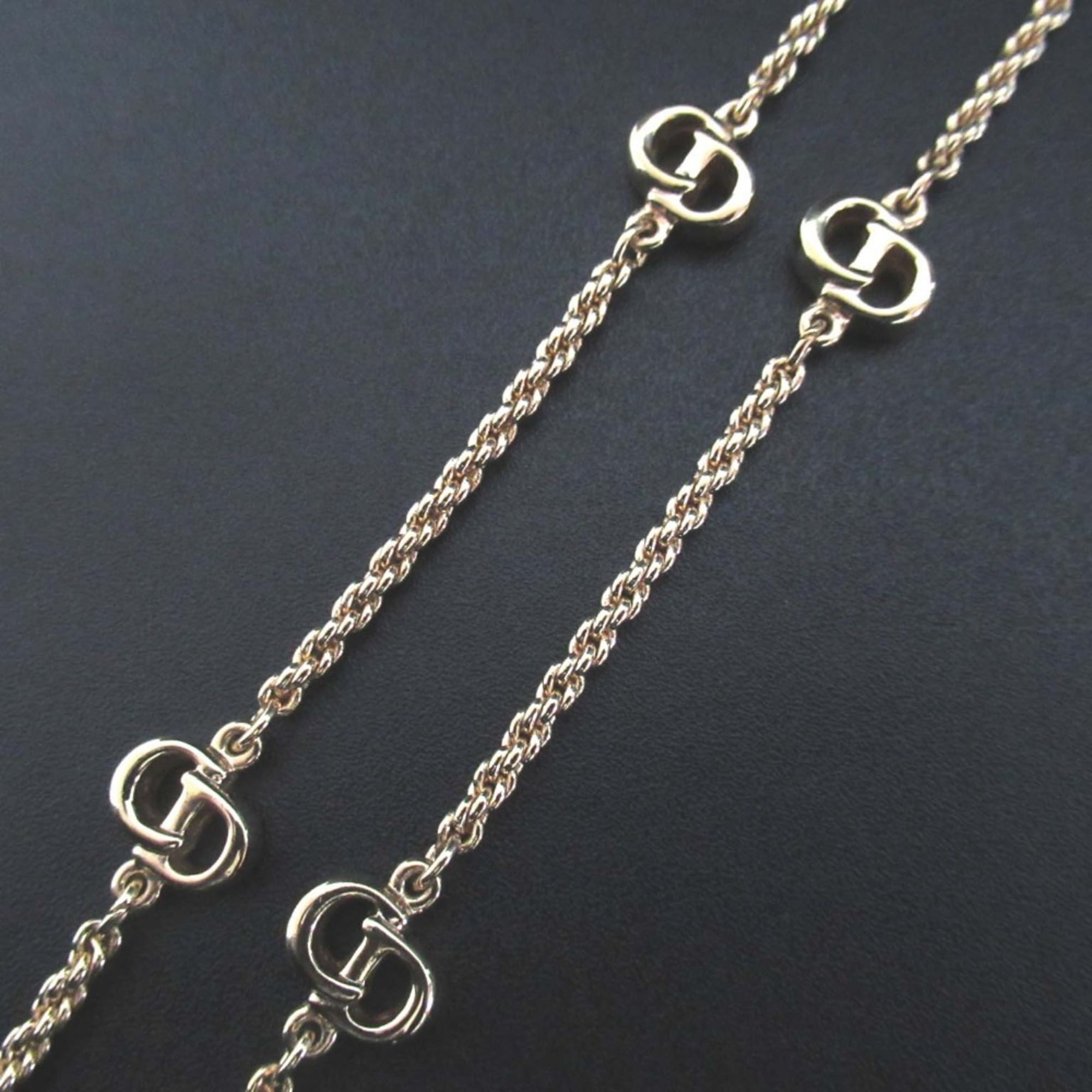 Vintage Christian Dior logo long necklace in gold.