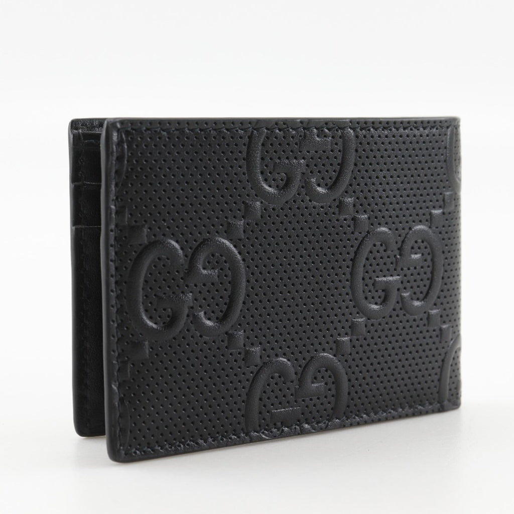 Gucci GG embossed bifold billfold 625559 in black calfskin with an open pattern for men