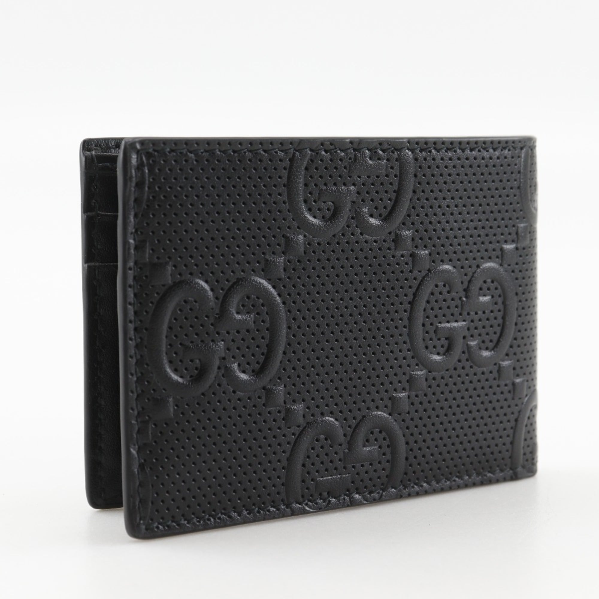 Gucci GG embossed bifold billfold 625559 in black calfskin with an open pattern for men