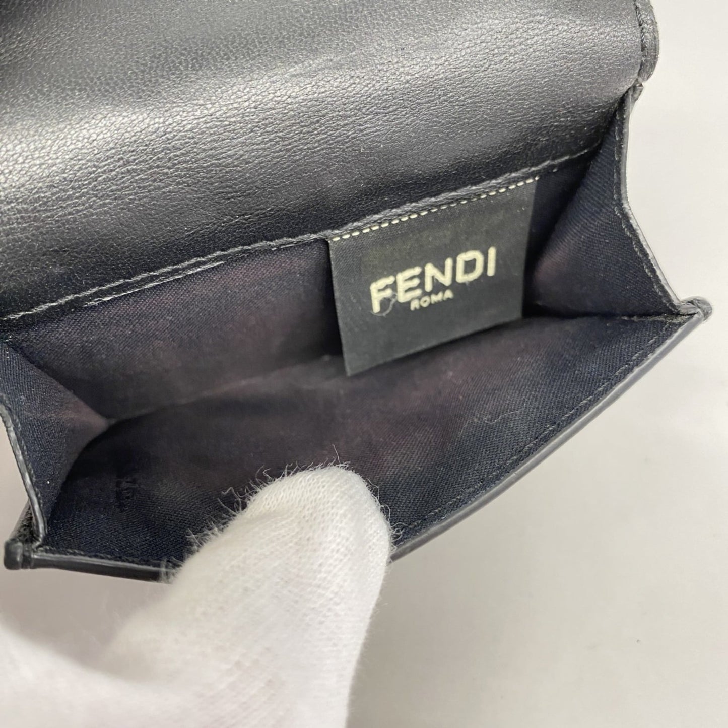 Fendi tri-fold wallet in black leather for women