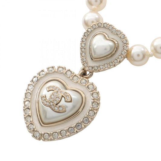 CHANEL Coco Mark Heart Necklace, Gold-Plated, with Faux Pearl and Rhinestones, Available in White, Gold, Clear.