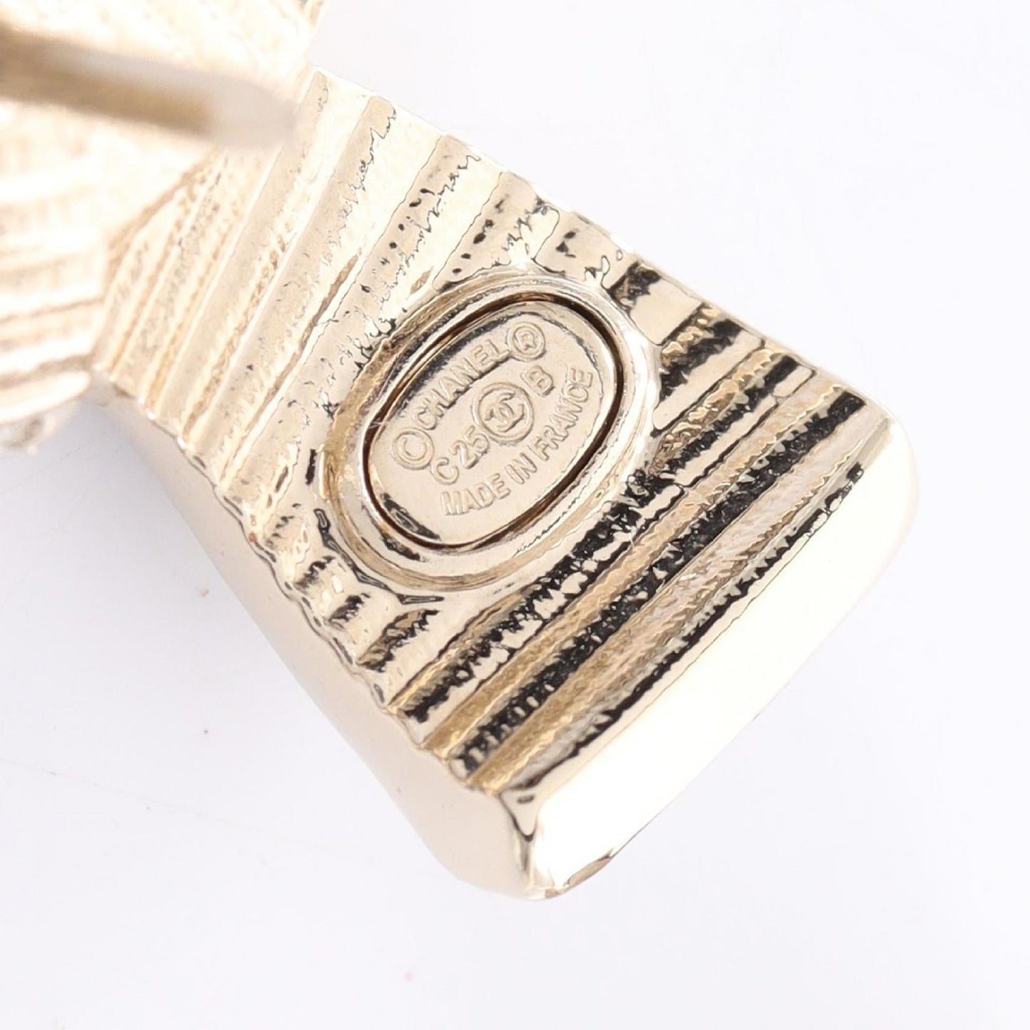 Chanel Coco Mark Ribbon Brooch with Gold-Plated Rhinestones, Available in Gold, Black, and Clear.