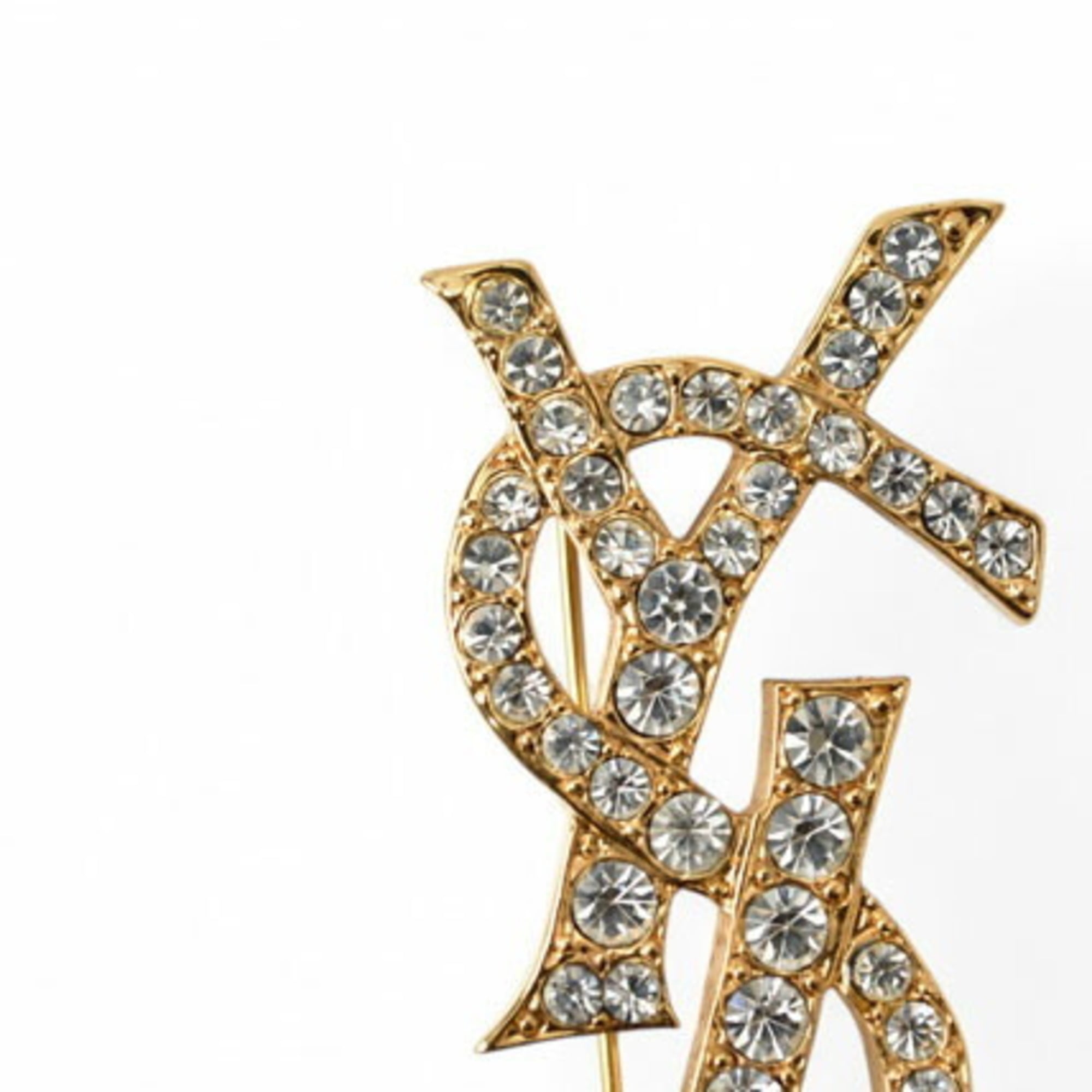 Yves Saint Laurent Saint Laurent pin brooch, badge, SAINT LAURENT monogram YSL, rhinestone, gold — Like New