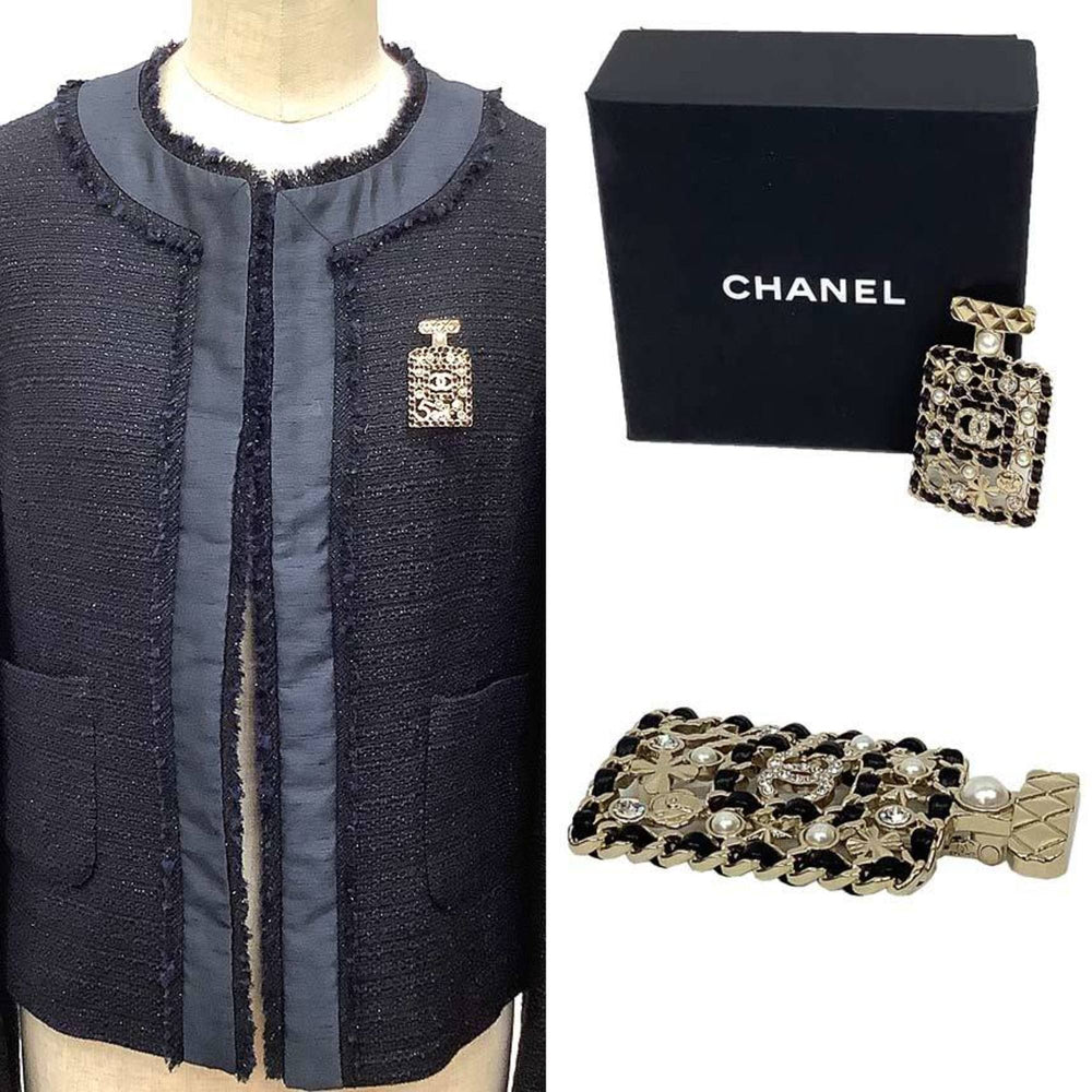 CHANEL Brooch with Bottle Motif, Matelasse Design, Clover, Camellia, Pearl, Coco Mark, Gold and Black, Brass Leather — New - Store Return