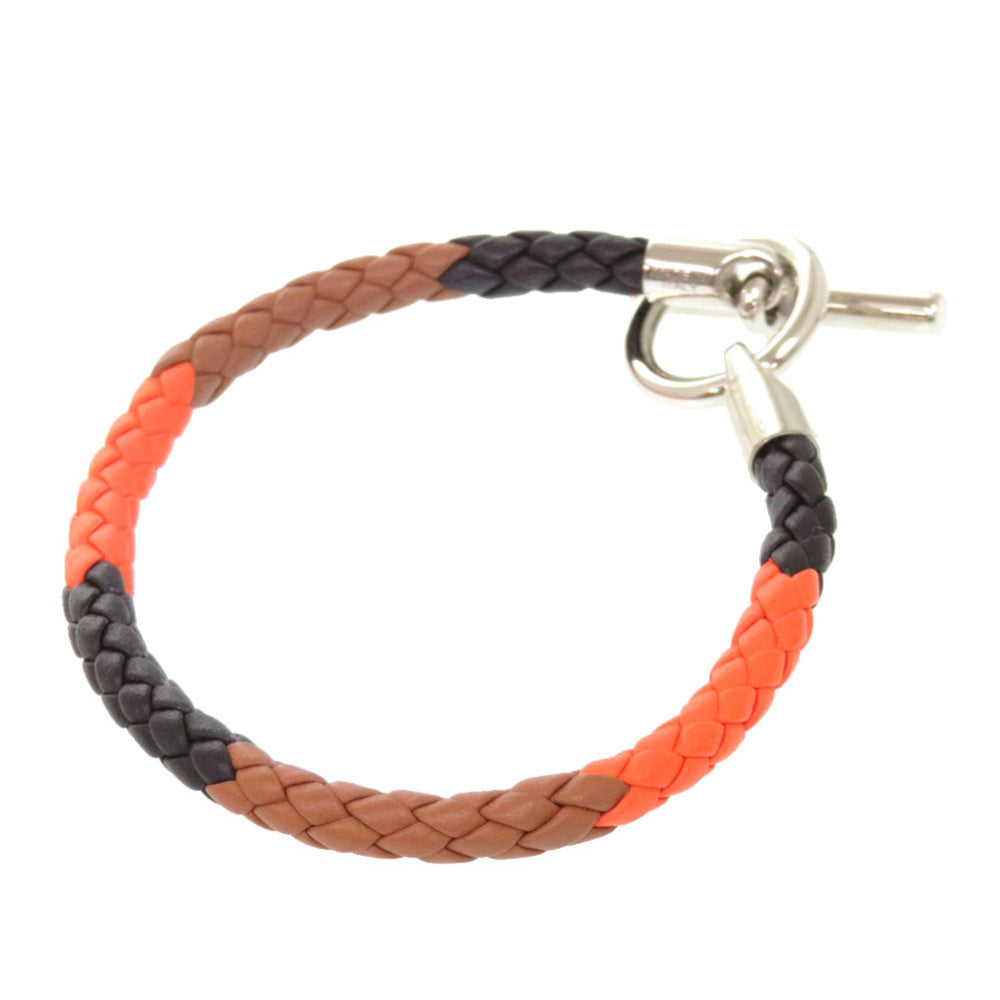 Hermes Like new Hermès Grennan leather bracelet in orange, brown, black, and silver hardware. 0991 — Like New