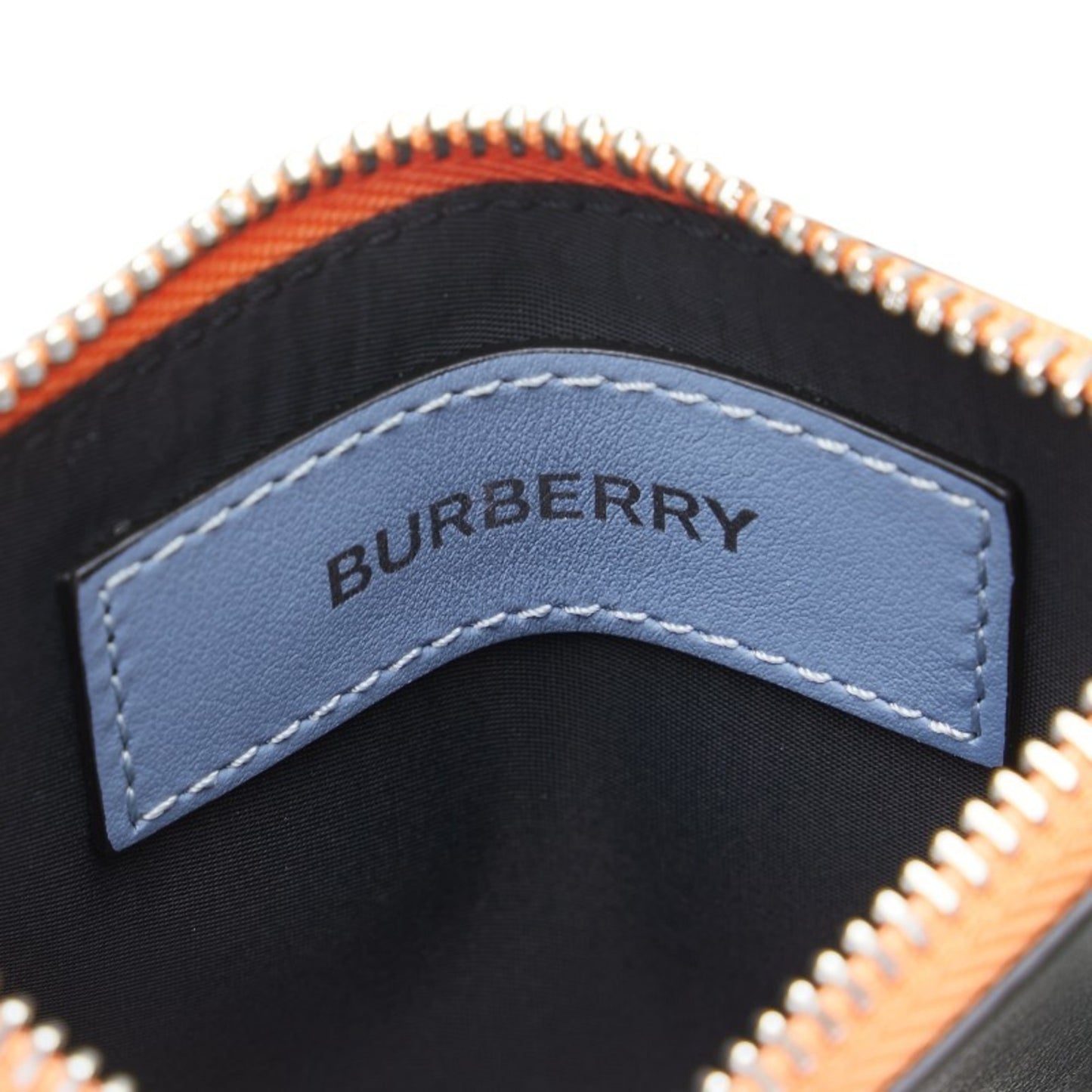 Burberry logo wallet/coin case in orange multicolored leather for women.