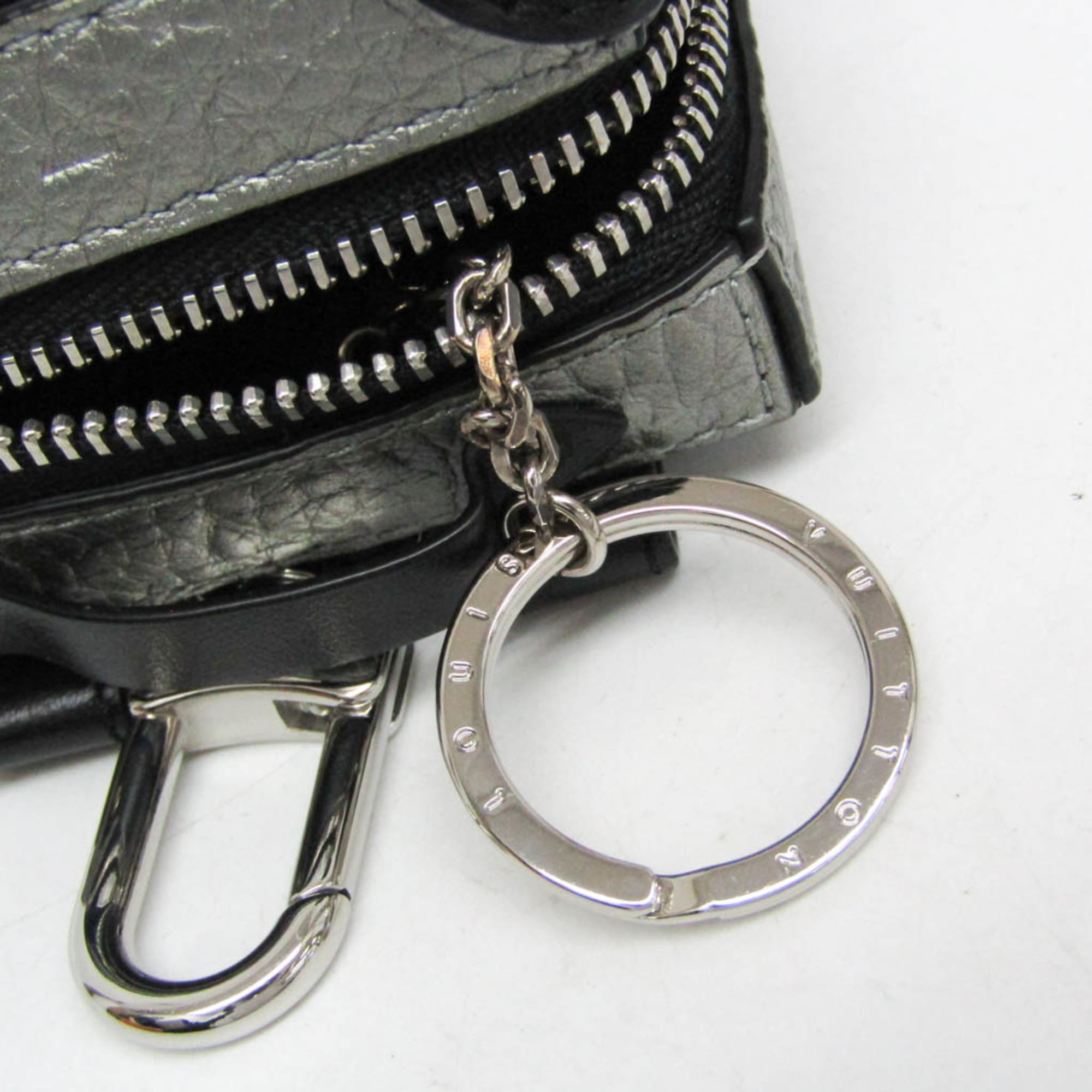 Louis Vuitton Leather Handbag Charm Silver,Black Pochette Soft Trunk Backpack M01392 — Like New
