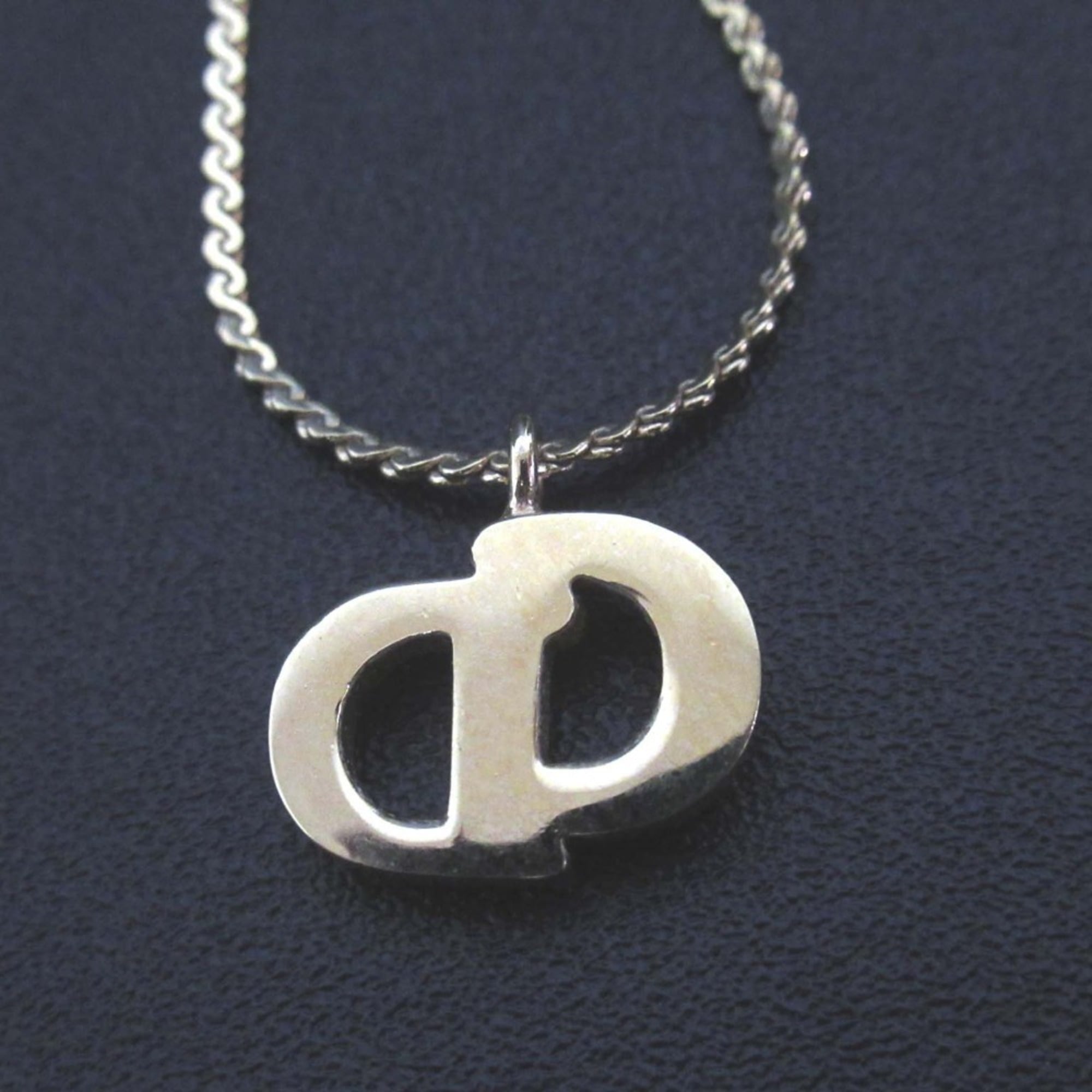 Vintage Christian Dior CD logo necklace pendant in gold for women.