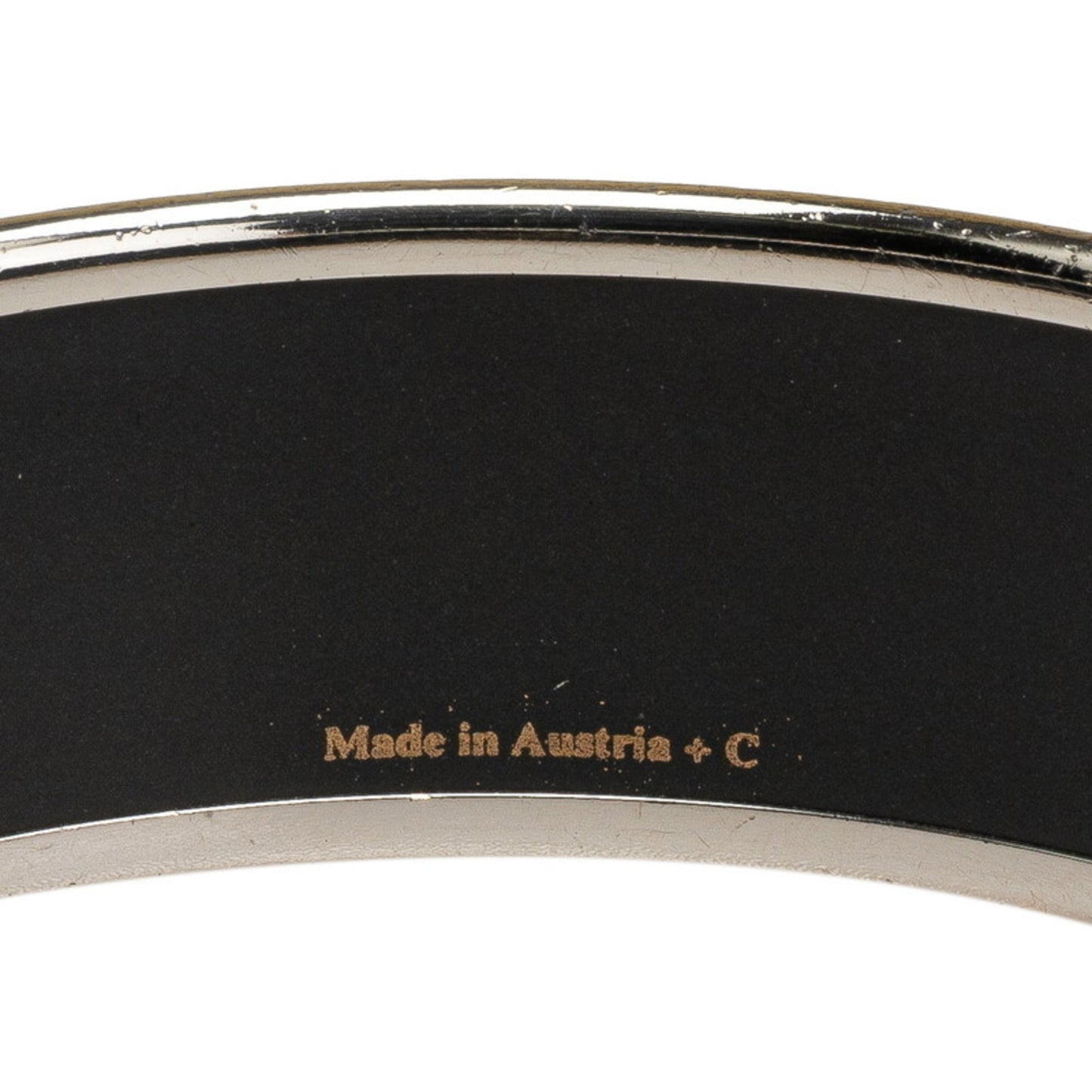 Hermes enamel horse, Pegasus, and star motif bangle in silver, black, multicolored metal for women.