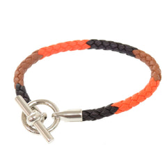 Hermes Like new Hermès Grennan leather bracelet in orange, brown, black, and silver hardware. 0991 — Like New