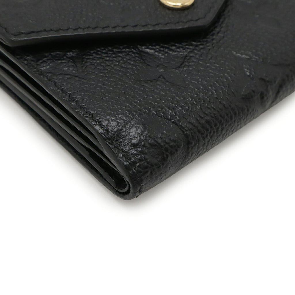 LOUIS VUITTON Monogram Empreinte Portefeuille Zoe Tri-fold Wallet in Black (Noir) M62935