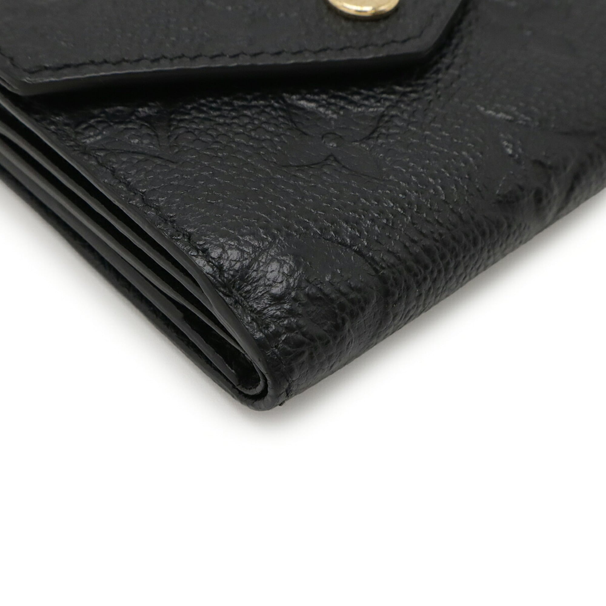 LOUIS VUITTON Monogram Empreinte Portefeuille Zoe Tri-fold Wallet in Black (Noir) M62935