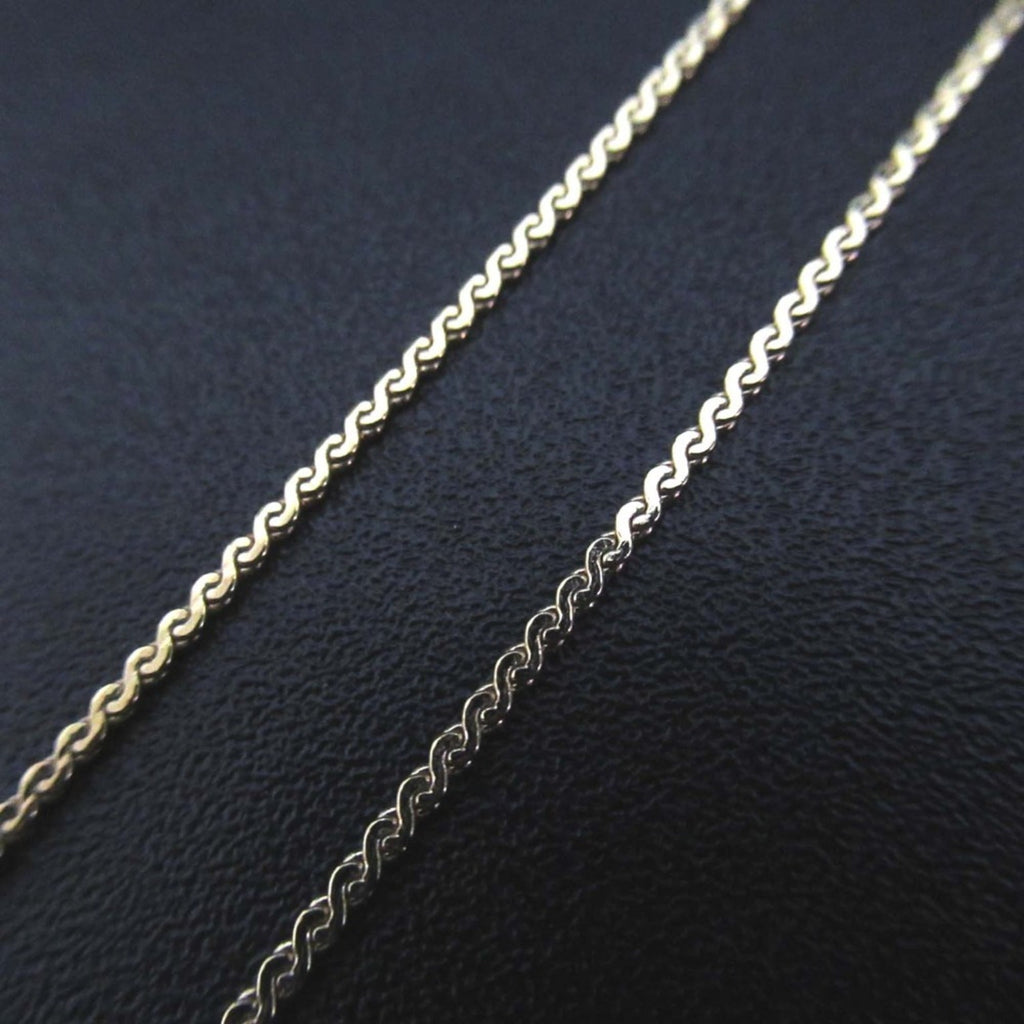 Vintage Christian Dior CD logo necklace pendant in gold for women.