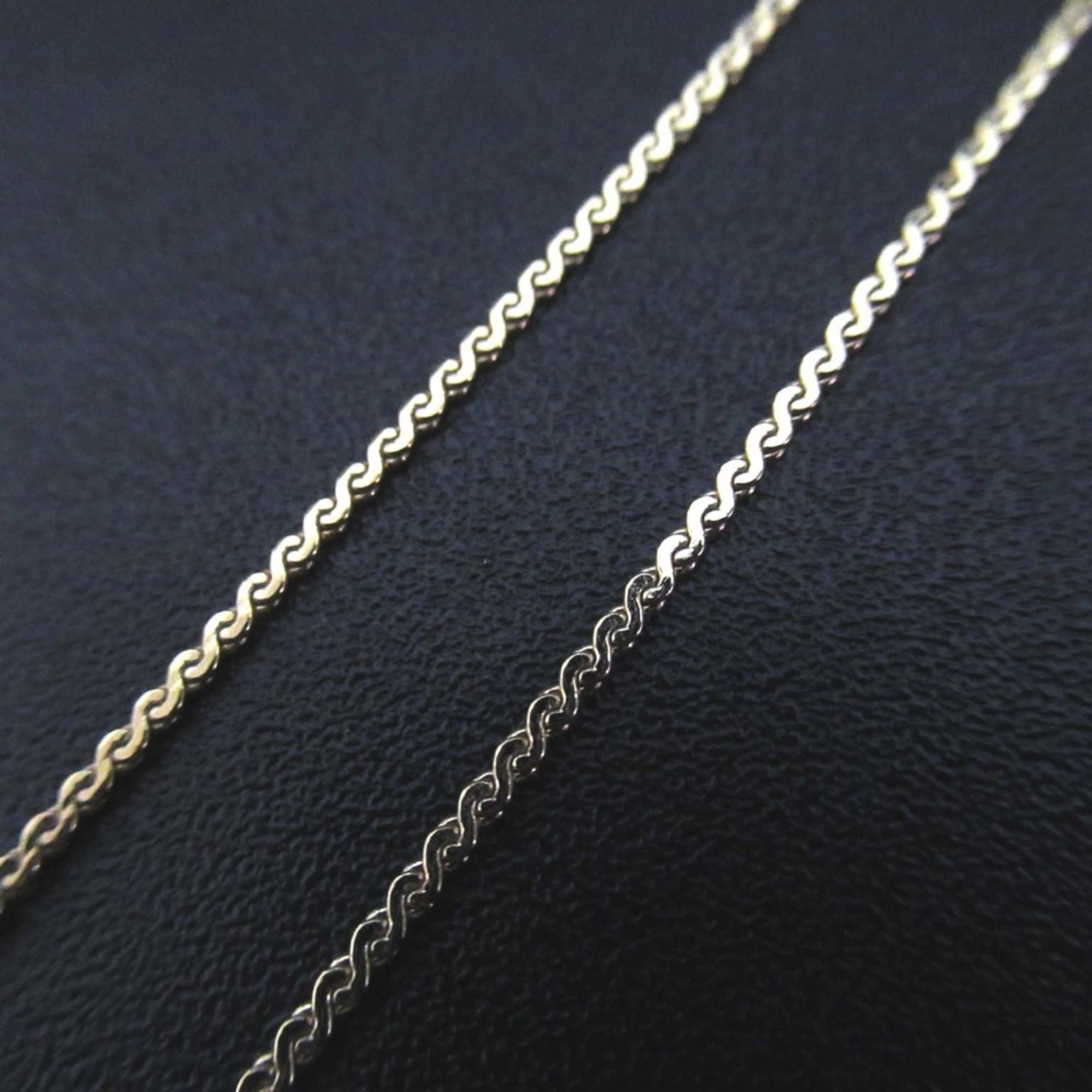 Vintage Christian Dior CD logo necklace pendant in gold for women.