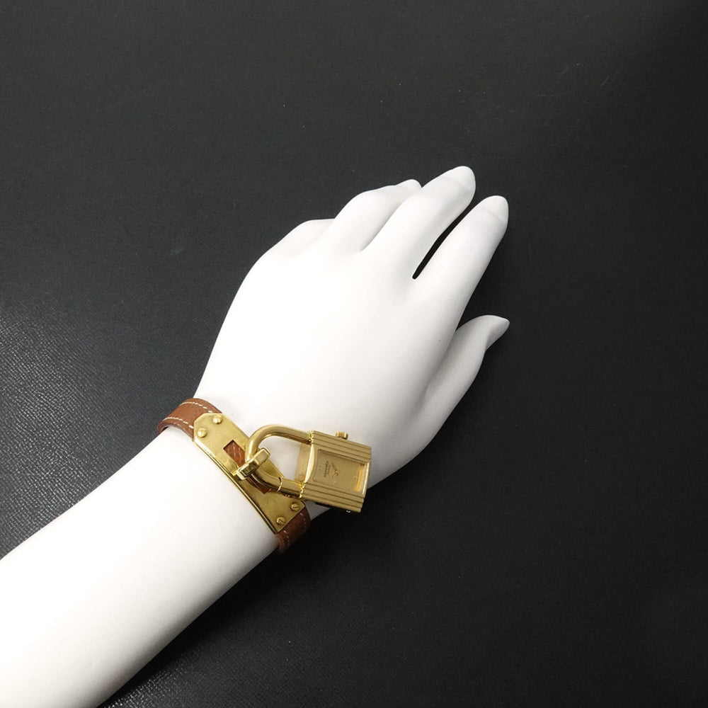 Hermes Kelly Watch, Ladies' Gold and Brown Quartz Watch with Padlock — Very Good