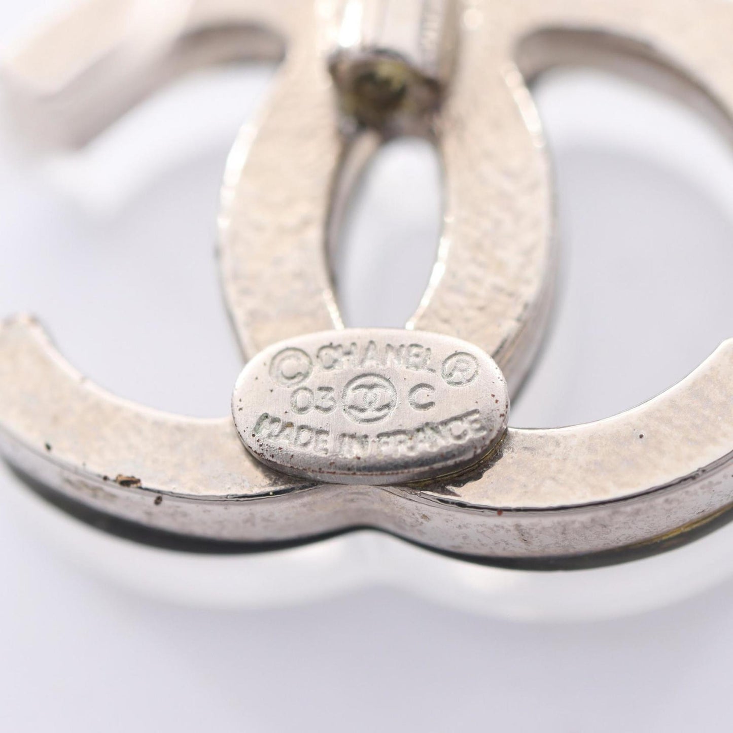 Chanel Coco Mark earrings, stainless steel and plastic, available in clear silver.