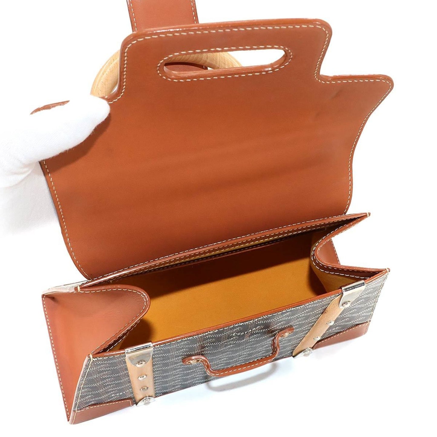 Goyard Saigon PM 2-way hand/shoulder bag in PVC, leather, wood, black, brown, and herringbone.