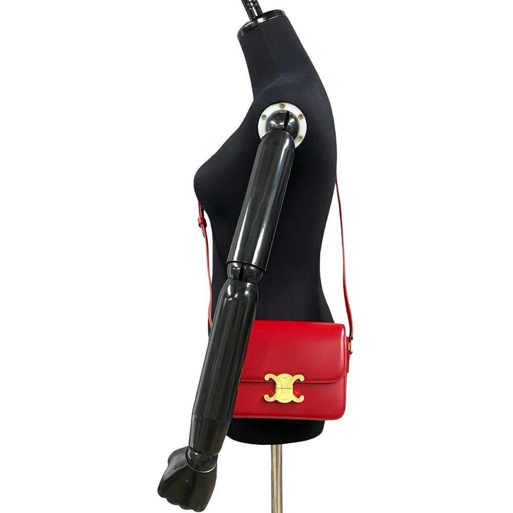 Unused, stored Celine Teen Triomphe logo hardware leather mini shoulder bag/pouch in red (23190) — Like New
