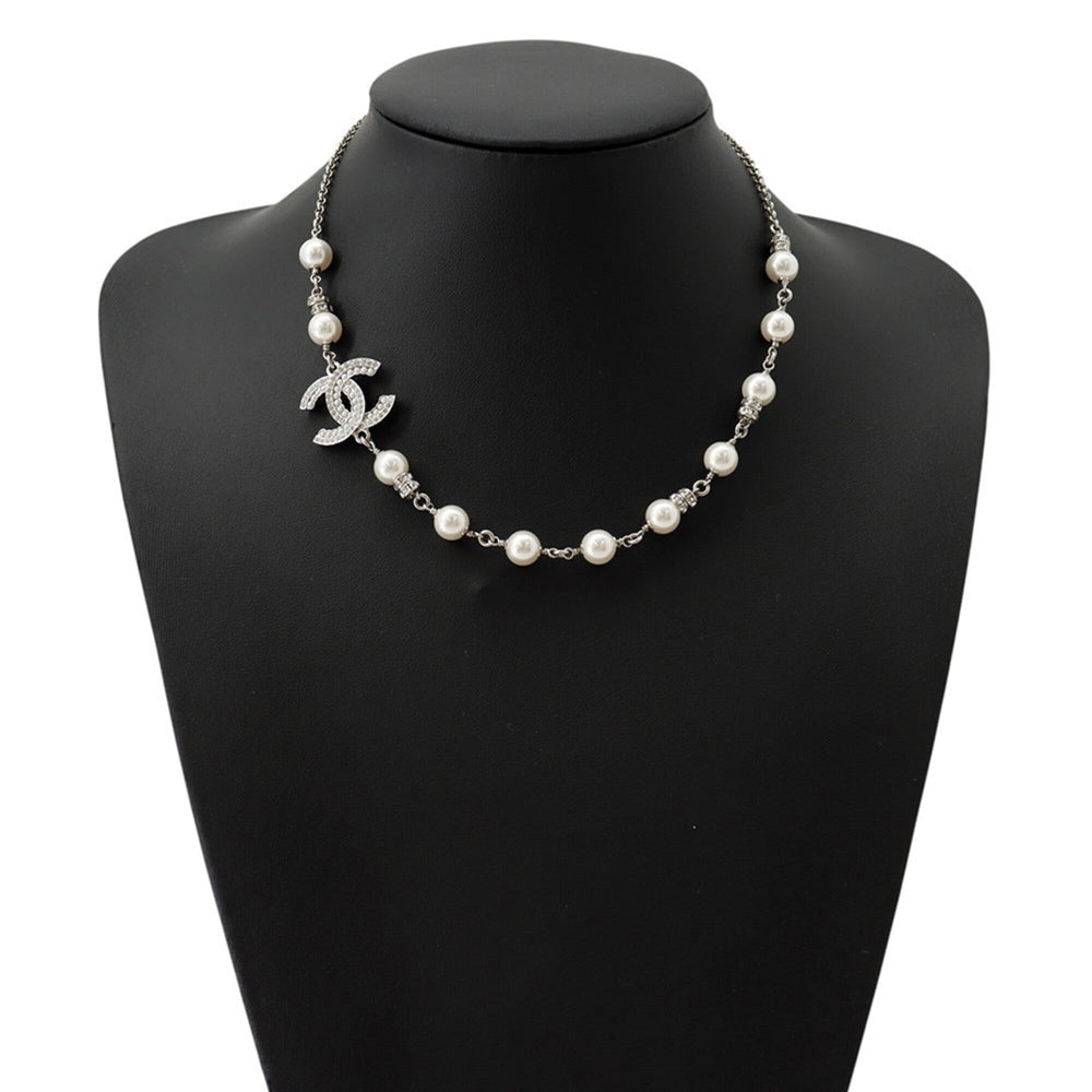 Chanel necklace with Coco Mark, faux pearl and rhinestone design. CHANEL for women — Like New