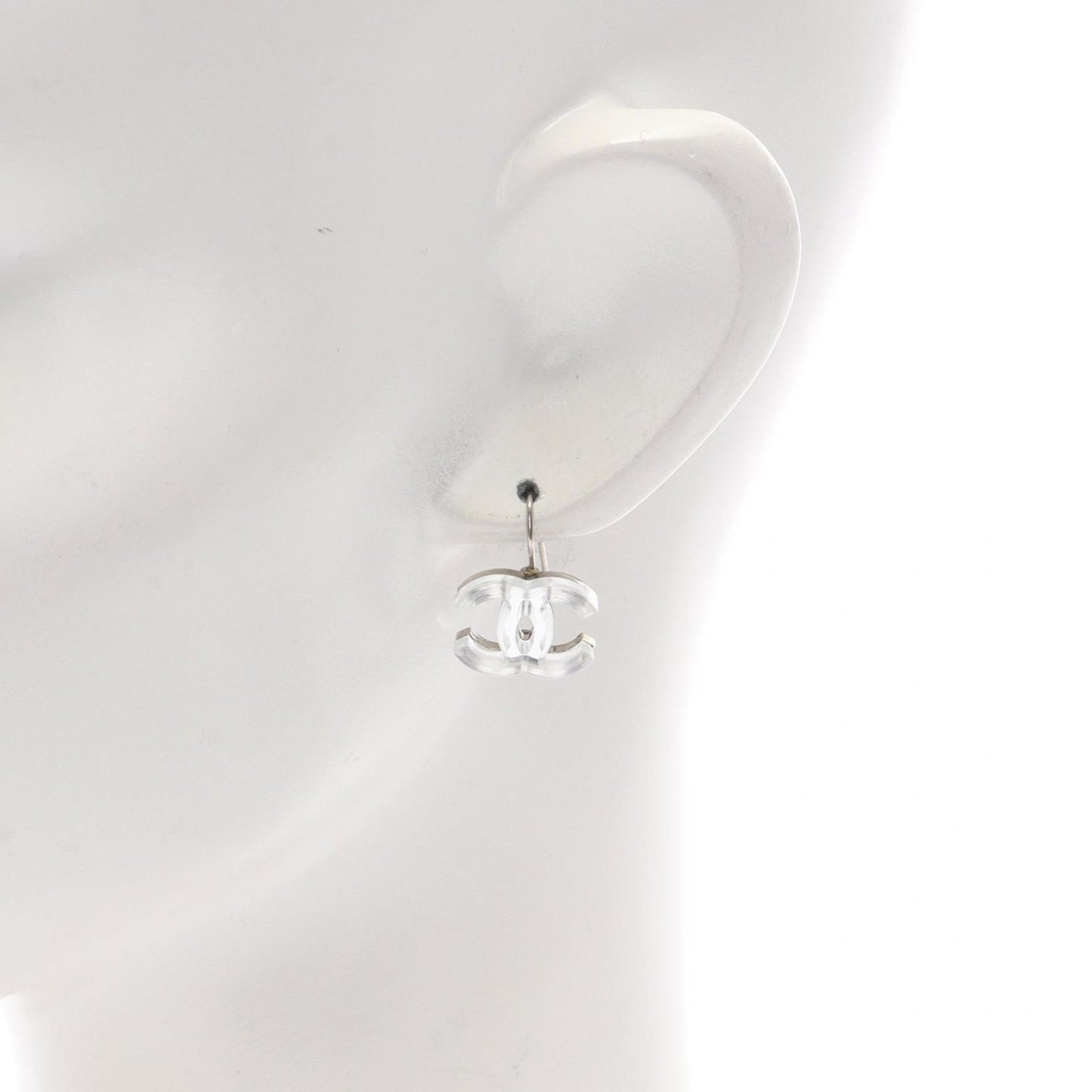 Chanel Coco Mark earrings, stainless steel and plastic, available in clear silver.