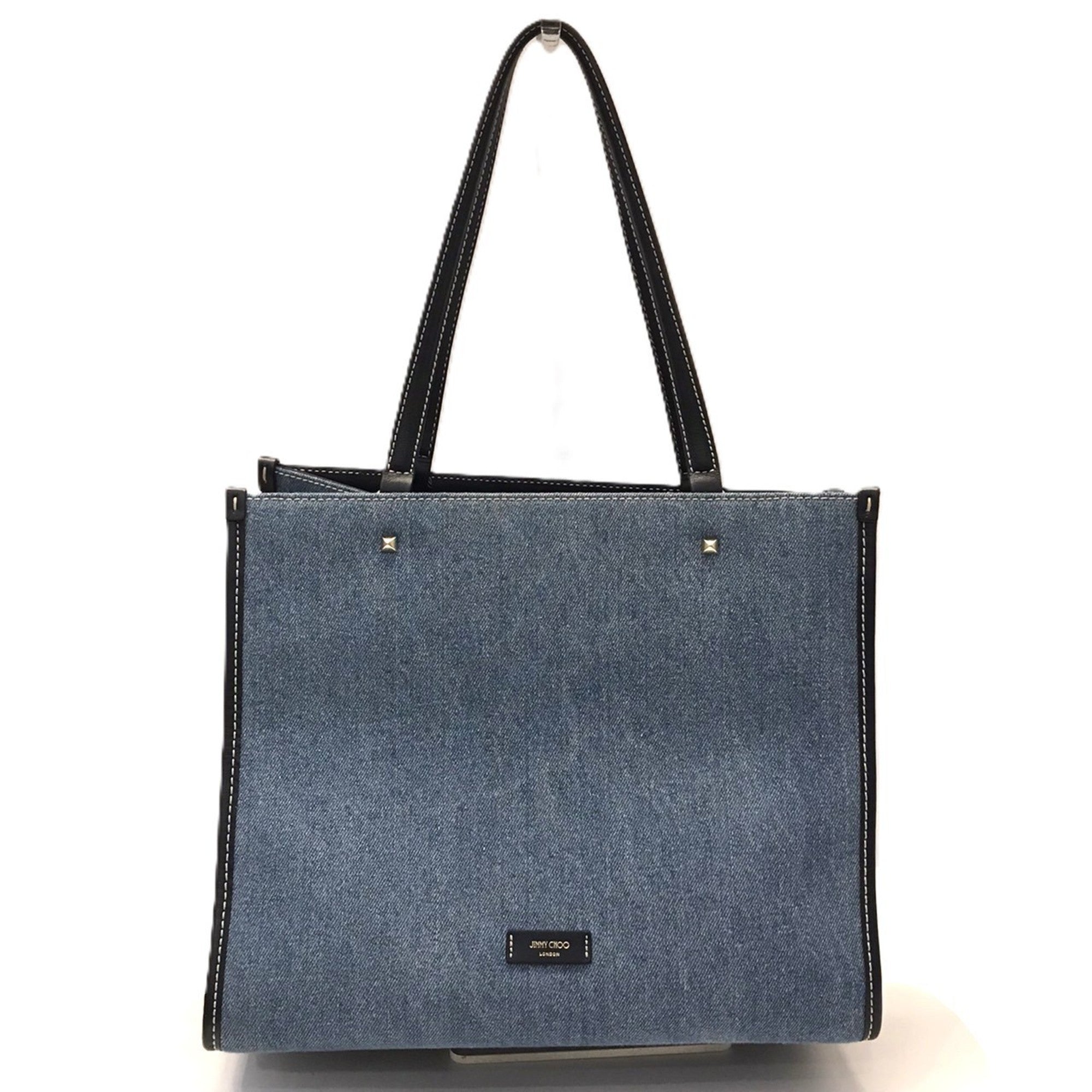 Jimmy Choo Varenne denim tote bag with embroidery and studs in indigo blue.