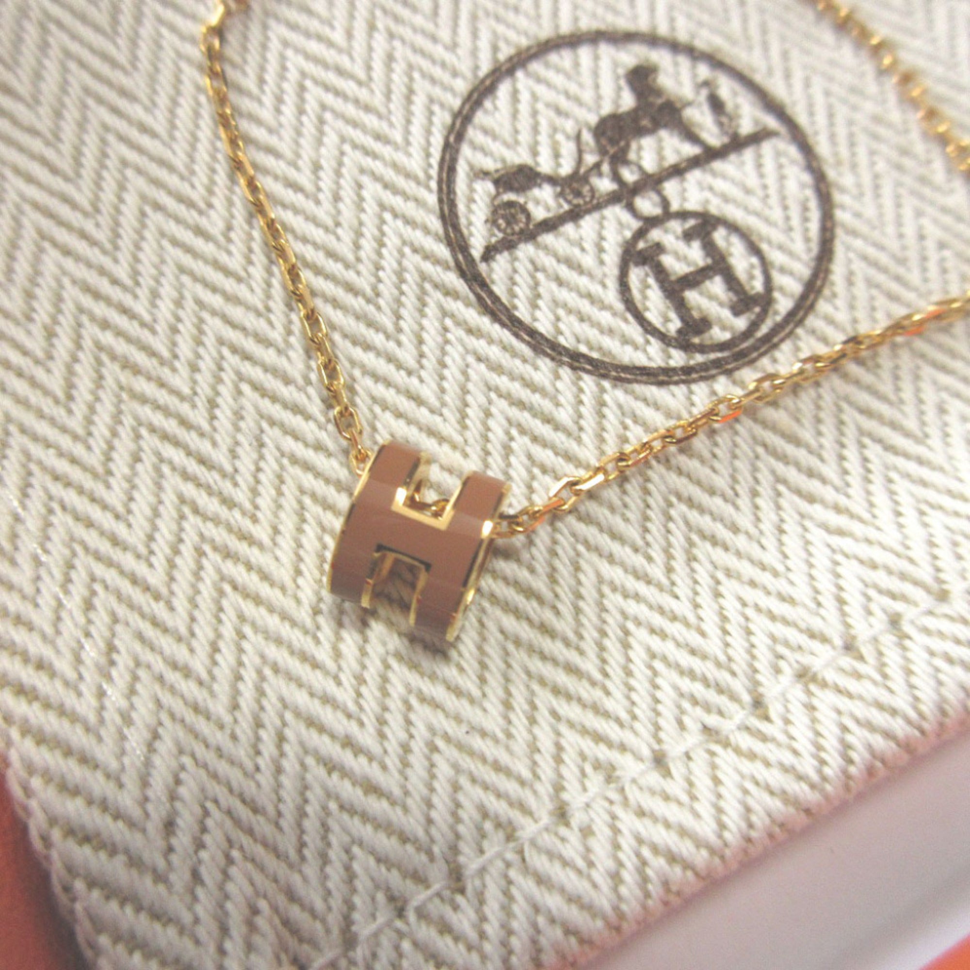 Like new Hermes Pop Ash Mini Metal New Gold Necklace 0508 — Like New