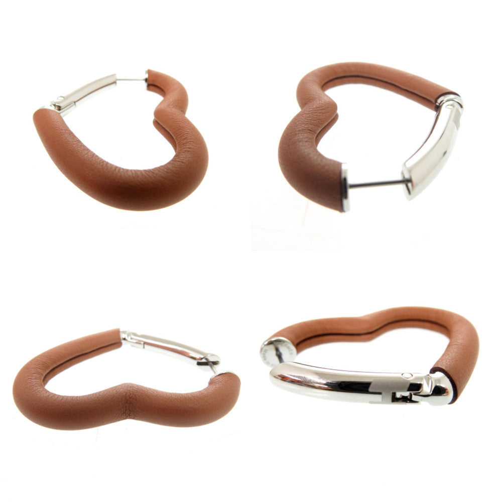 Hermes Like new Hermès Au Coeur du Faubourg COEUR DU FAUBOURG 500243FKAU earrings in Swift leather, palladium gold, 1401 — Like New