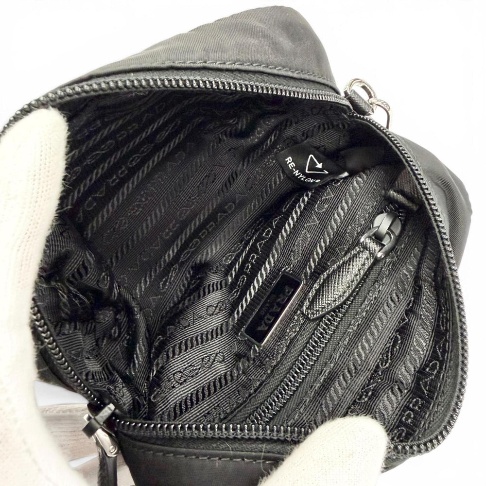 PRADA 1NS175 Vera Re-Nylon Mini Pouch Small Current Model Triangle Logo Plate Cosmetic Black Made in Italy Women's — Like New
