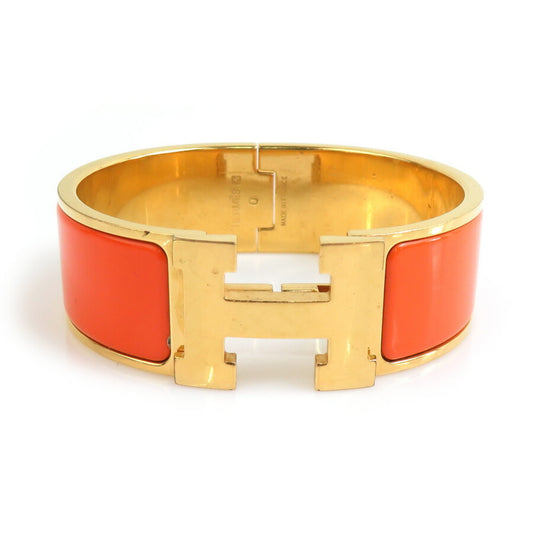 Hermes Hermès Click-Clack Metal Enamel Bangle Bracelet in Gold and Orange for Women (e60667a)