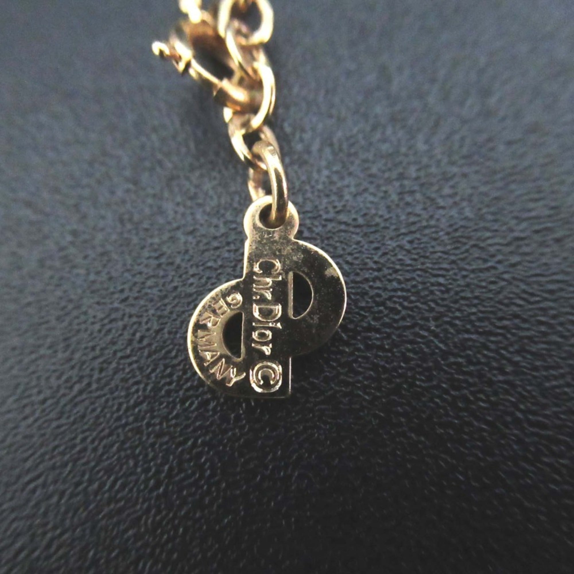 Vintage Christian Dior shell motif necklace pendant in gold for women.