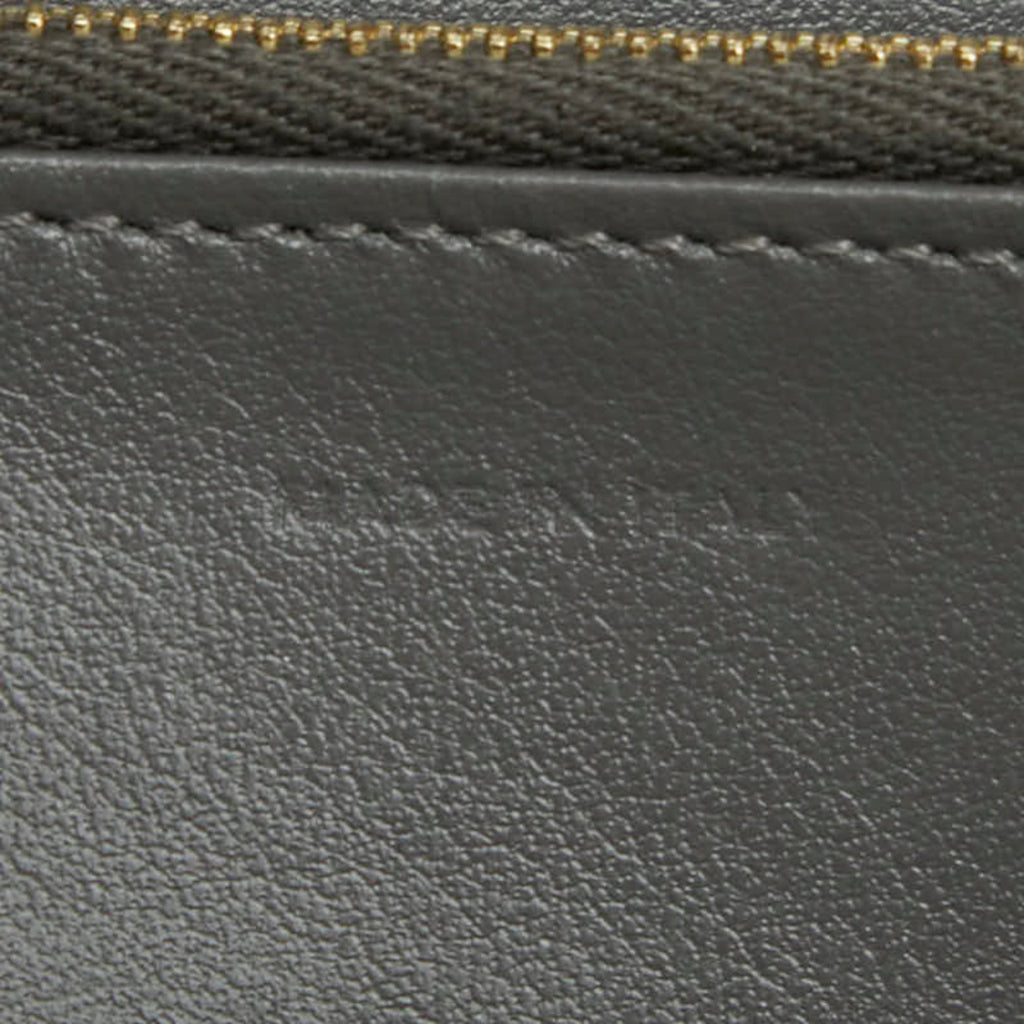 Celine round zipper long wallet in gray leather for women.