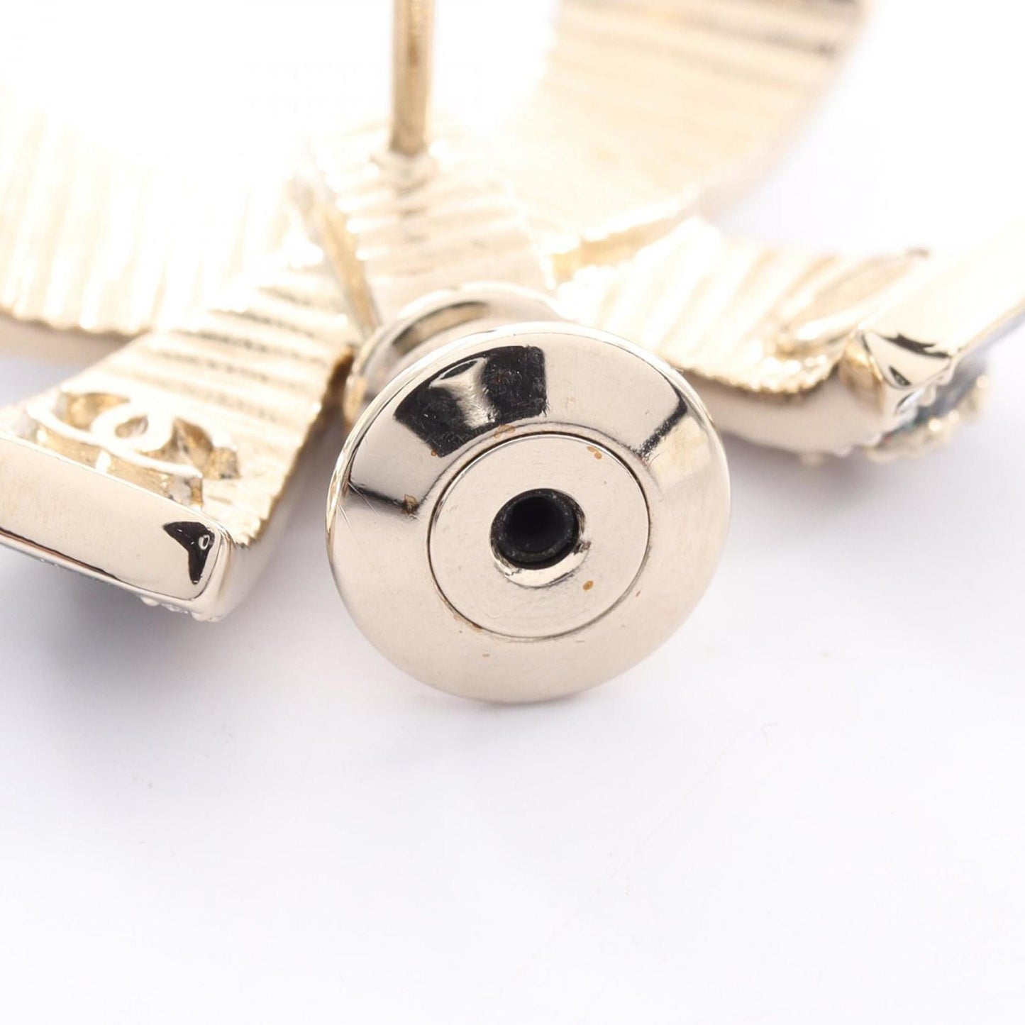 Chanel Coco Mark Ribbon Brooch with Gold-Plated Rhinestones, Available in Gold, Black, and Clear.