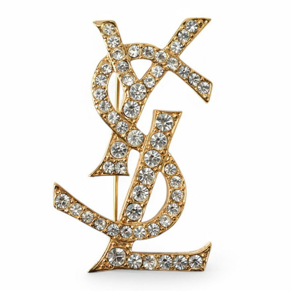 Yves Saint Laurent Saint Laurent pin brooch, badge, SAINT LAURENT monogram YSL, rhinestone, gold — Like New