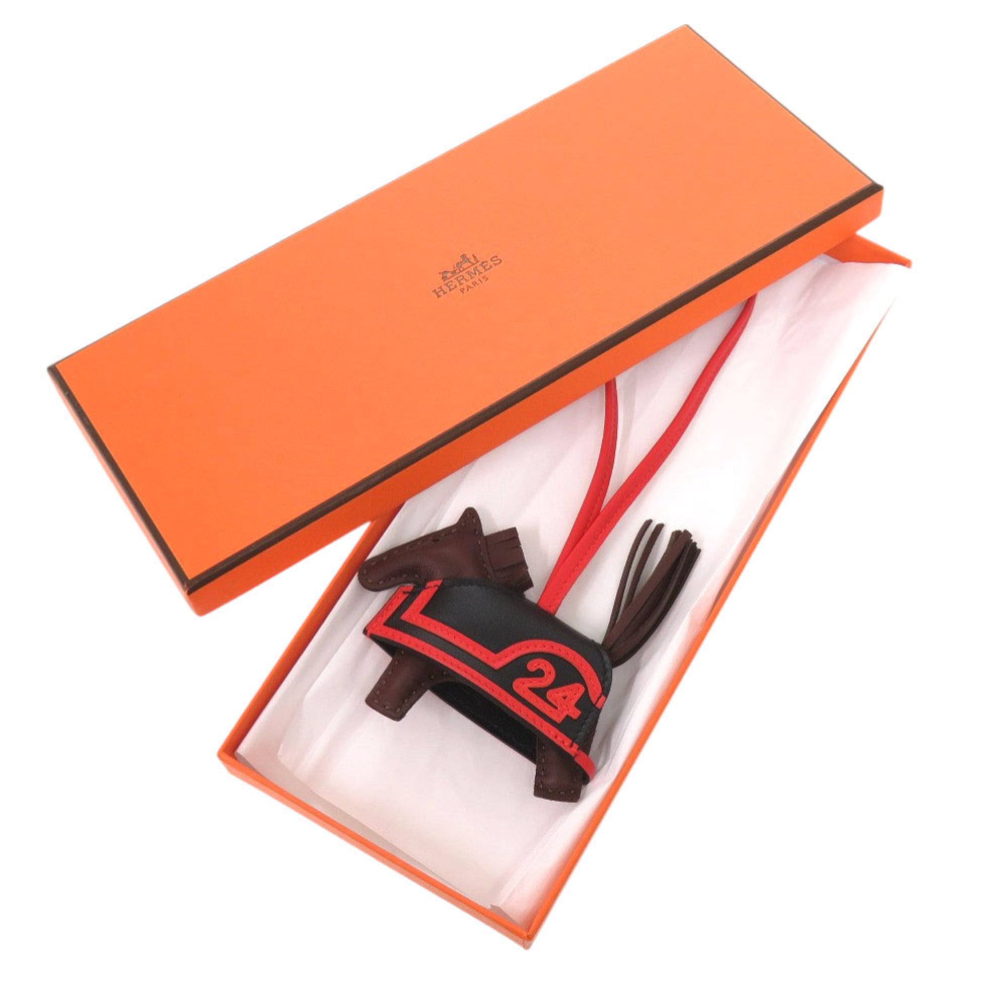 Hermes Robeo 24 PM Agneau Milo Black Terre Capucines K stamp (2025 production) Accessory Bag Charm 1119 HERMES — New - Store Return