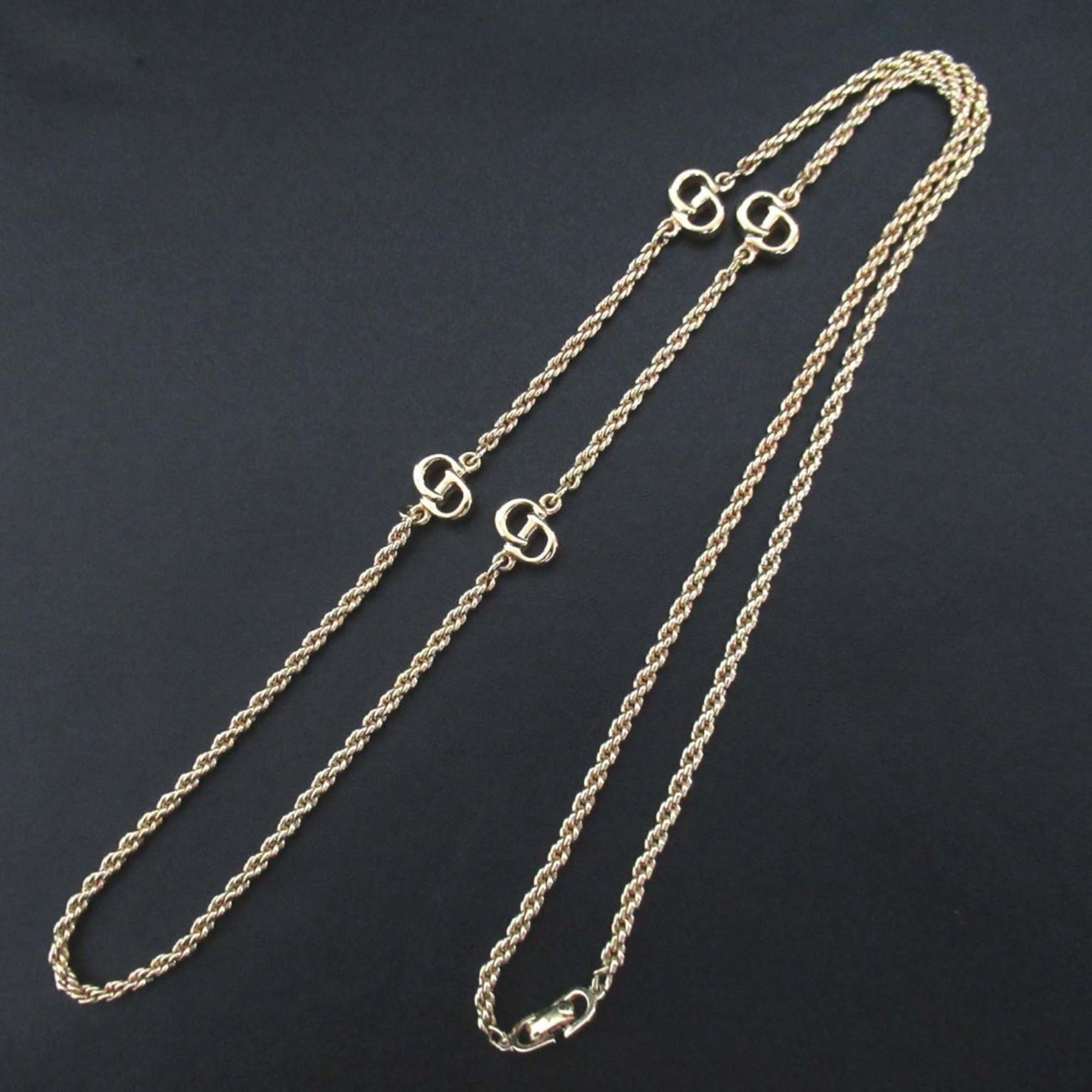 Vintage Christian Dior logo long necklace in gold.
