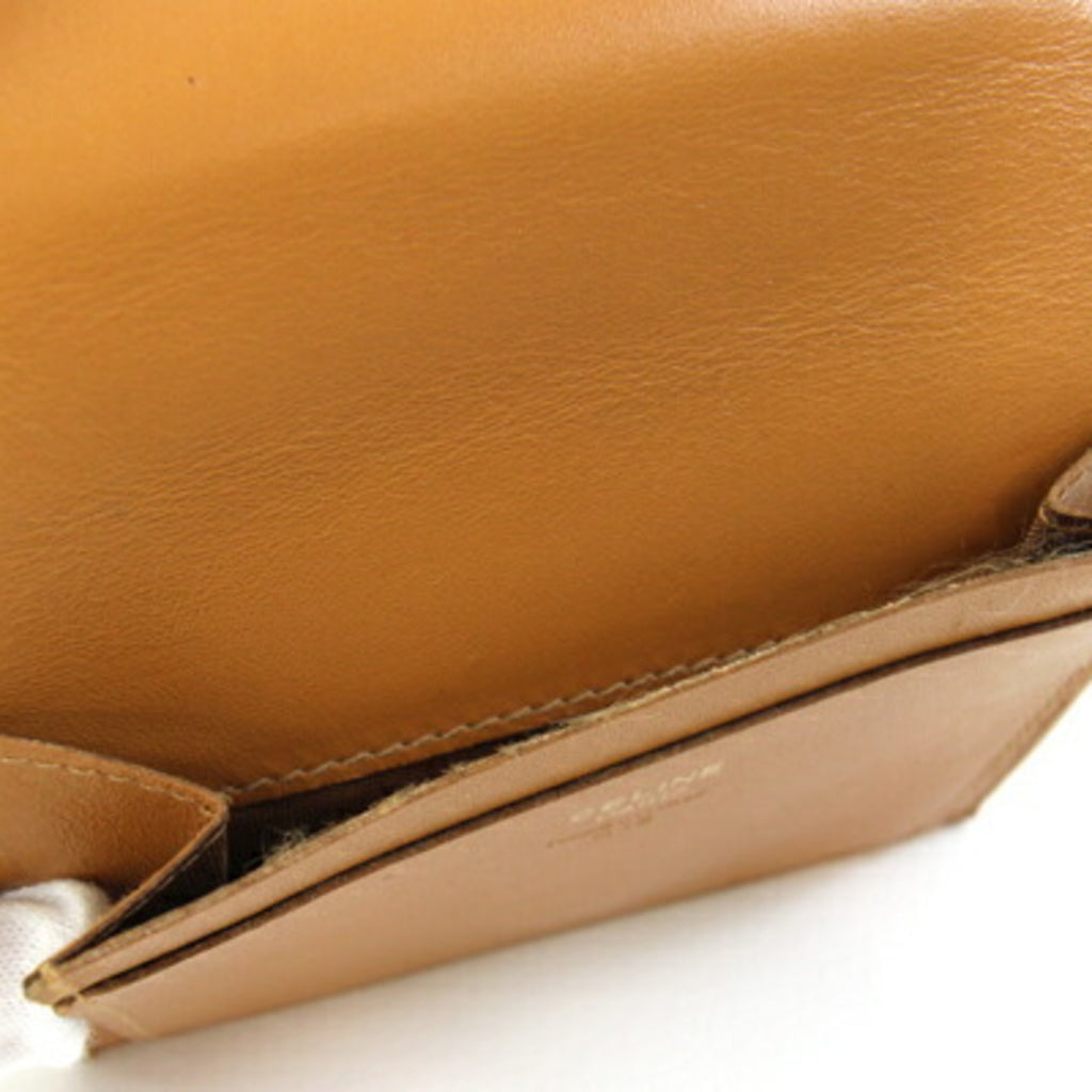 Celine bifold wallet in macadam, dark brown, beige, PVC, and leather. Compact wallet/mini wallet. For older women.