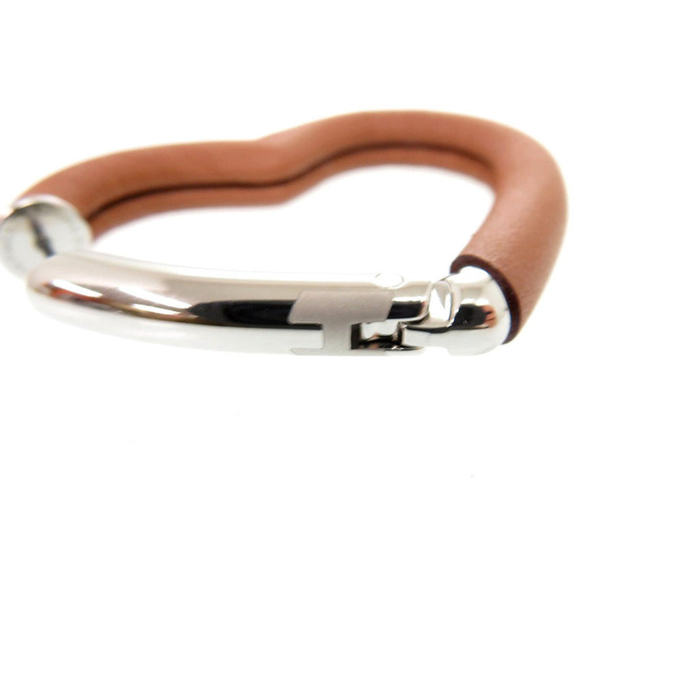 Hermes Like new Hermès Au Coeur du Faubourg COEUR DU FAUBOURG 500243FKAU earrings in Swift leather, palladium gold, 1401 — Like New